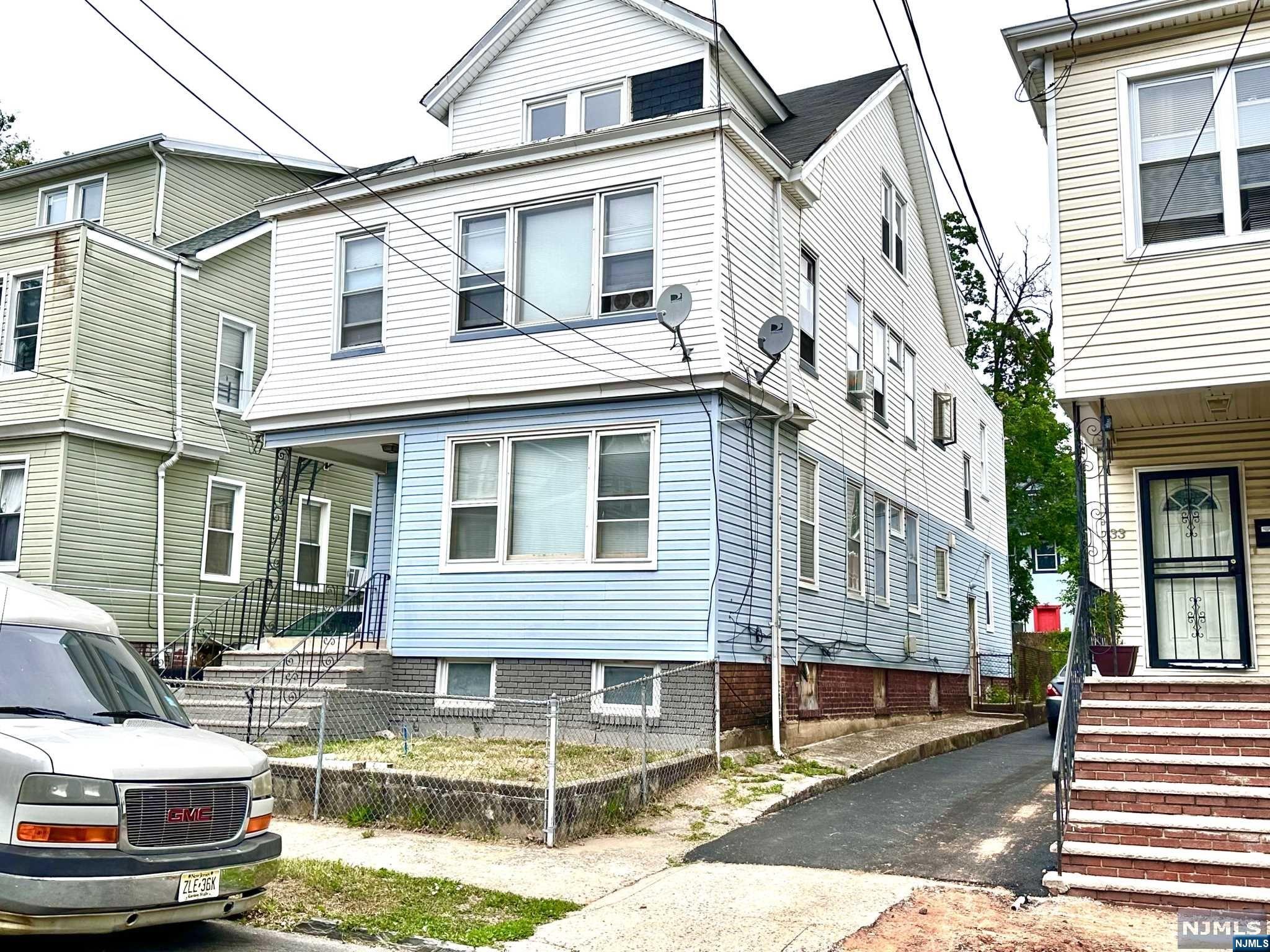 Large Two Family Home with Finished Attic In Need of TLC. Each Floor comes with 3 Bedrooms, Living Room, Dining Room, Bathroom. 2nd Floor Unit comes with Laundry Area. Home has a Driveway with a Very Nice Back Yard. Basement is Tall and Unfinished but with a lot of Possibilities. Great Opportunity for a Rehab Loan, FHA 203K Loan or Cash Offers. Located right behind the Newark Beth Israel Medical Center on a One Way Street and Close to Schools, Hospital, Houses of Worship, Shops, Restaurants, Access Main Roads. Home being Sold "as is" and buyer responsible to obtain Certificate of Occupancy.