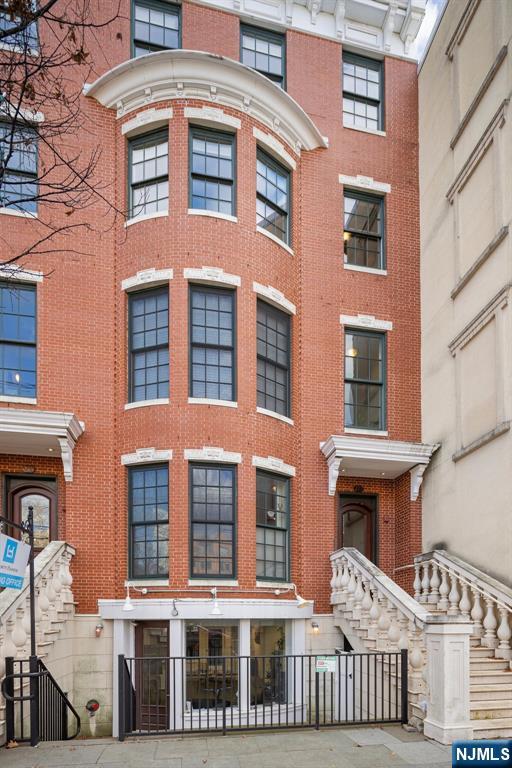 One-of-a-kind 1 bed, 1.5 bath brownstone condo at Liberty Harbor.