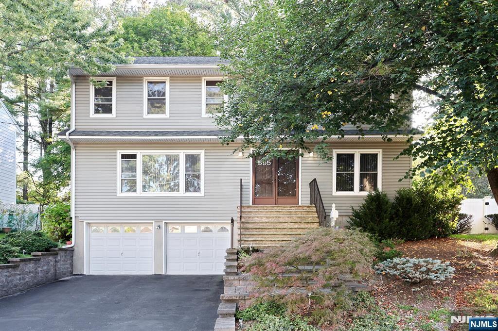 Welcome to your next home at 555 Prospect Ave with 2240 sq ft of living space! A++ location on a dead-end street backing up to White Beeches golf course! Very short distance to Selzer school (K-8th). Enter into the tiled foyer, Large living room & formal dining room w/hardwood floors, Large eat-in-kitchen w/quartz counters, stainless steel appliances & sliding glass doors to deck, Large family room (hardwood floors under carpet) w/wood burning fireplace, 1/2 bath & laundry area. The 2nd floor boasts a large primary suite w/full bath, 3 additional bedrooms & main full bath. There is also a partial basement with high ceilings just waiting to be finished with entrance into the 2 car garage! Other features include a whole house fan, 2 zone gas hotwater baseboard heat (2020), new hot water heater (2020), young roof & retaining walls (2013), fenced yard, sprinkler system, maintenance free vinyl siding and so much more! Schedule your appointment today & make this home your new address!