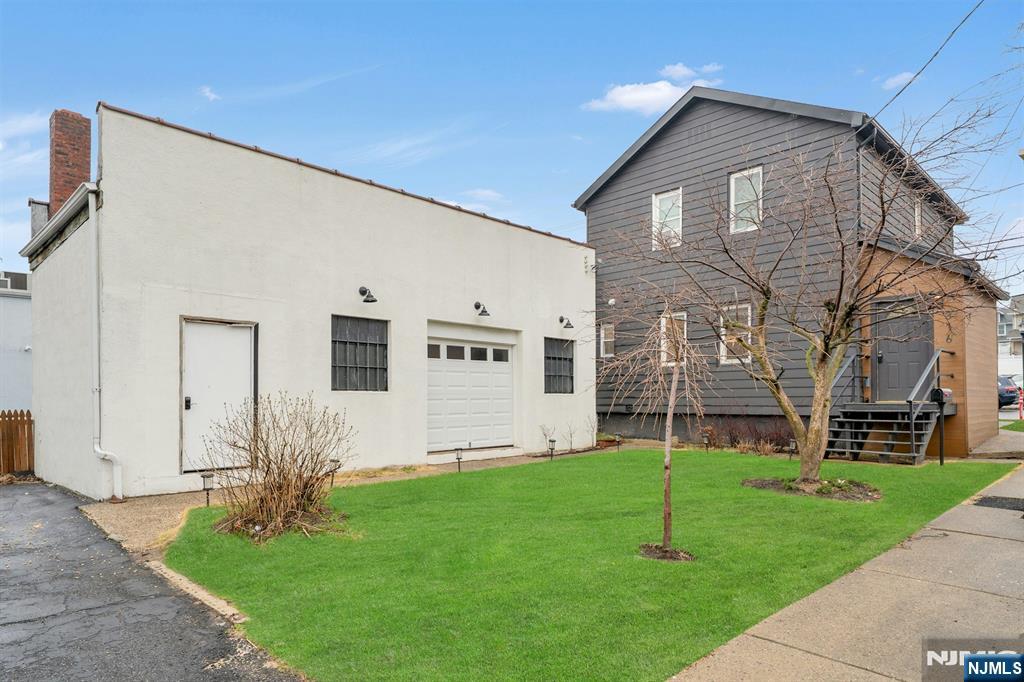 Team Braconi Present a Rare Bergen County mixed-use on high-visibility Palisade Ave, three income streams, one address, and a cap rate that makes sense. Street-level commercial suite with floor-to-ceiling glass storefront, open flexible layout, private bath, and dedicated storage, B-1 zoning permits retail, salon, restaurant, fitness, daycare, professional offices, and more. Massive rear garage with roll-up door adds a second commercial income stream with real value-add potential. Upstairs, a fully renovated 3BR/1.1BA apartment with quartz kitchen island, spa-grade frameless glass shower, marble vanity, and in-unit W/D, the finish that keeps quality tenants. Unfinished basement offers additional upside. Separate entrances, private parking, minutes to Rt. 4, GWB & NYC. Owner-occupants: run your business while the building pays your mortgage. Investors: strong stabilized returns with room to grow. Bergen County mixed-use at a an attractive price point