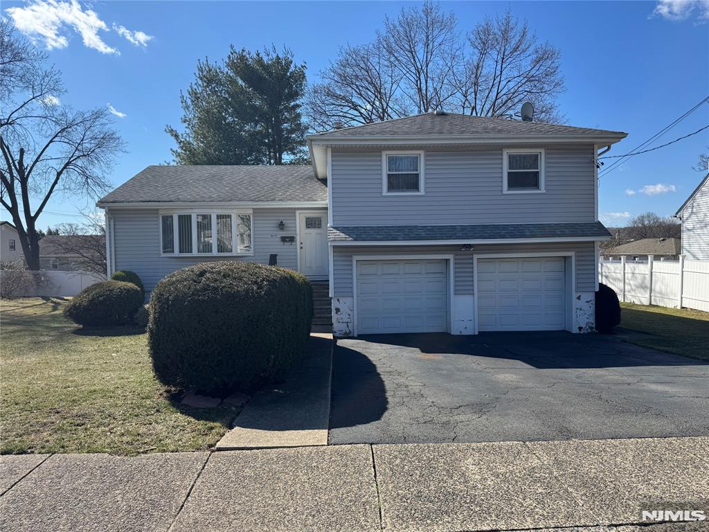This spacious tri-level split home boasts great curb appeal and over 1,600 sq. ft. of inviting living space on an 80 x 100 lot. Nestled in a quiet cul-de-sac, this home features a large entertainment room that opens to the backyard perfect for hosting or relaxing. Additional highlights include a 2-car attached garage and central air conditioning. Conveniently located near transportation, major highways, and shopping, this home offers both convenience and accessibility. Don't miss out on this fantastic opportunity!