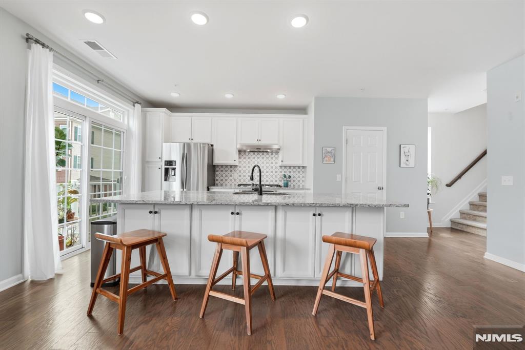 Call Mital Kataria at 732-789-0670 to schedule a tour. Experience a convenient lifestyle at one of the most sought after communities in Bergen county. Step into your beautiful END UNIT townhome approx 2000 sq ft to experience a bright & spacious interior featuring open floor plan. The home is tastefully upgraded on all levels featuring 3 generous size bedrms, 2.5 baths with 2 car parking. 2nd floor features open modern kitchen, dining area with powder bath, a sun-filled living room w/ PATIO. Kitchen offers Gourmet appliances, granite countertop, backsplash, upgraded faucet and much more. Head upstairs to huge Master bedroom which offers huge HIS & HER walk-in closets. Master bath offers dual vanity, standing shower & soaking tub. Spacious 2nd & 3rd bedrooms w/ office space outside the bedroom for your WFH needs. Conveniently Located From NJ Transit Train & Bus Stops.