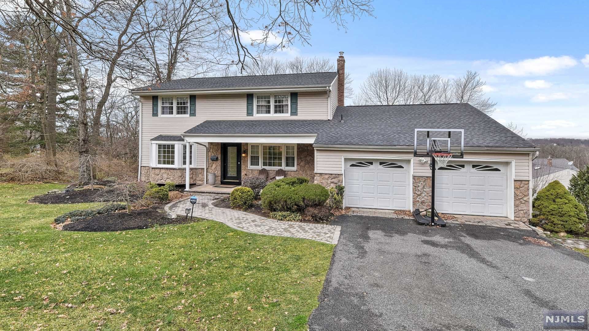 Final and Best Tue. 1/11 @4PM Splendid design and functionality gives this classic Colonial a twist offering a Great Room addition creating an open concept for today's modern living. This fabulous 4 bedroom 2.5 bath home offers hardwood floors throughout, updated EIK w/great work space, Viking Appliances, center island, granite counters & breakfast Rm. Seamless transition from a huge Dining Rm to Kitchen into the Great Rm with stone gas fireplace & oversized palladium window filtering light with spectacular mountain views & provides access a trex deck, creating an entertainers haven. Front to back Dining Rm is ideal for intimate gatherings. 2nd floor features MBS w/en-suite & wic, 3 additional Bedrooms main bath & pull down stairs attic. Finished walk-out basement w/dry bar & plenty of storage opens to an entertainers covered patio with the ultimate outdoor Kitchen & spacious yard. Additional features include Newer Roof, a charming front porch,main flr laundry 2 car garage