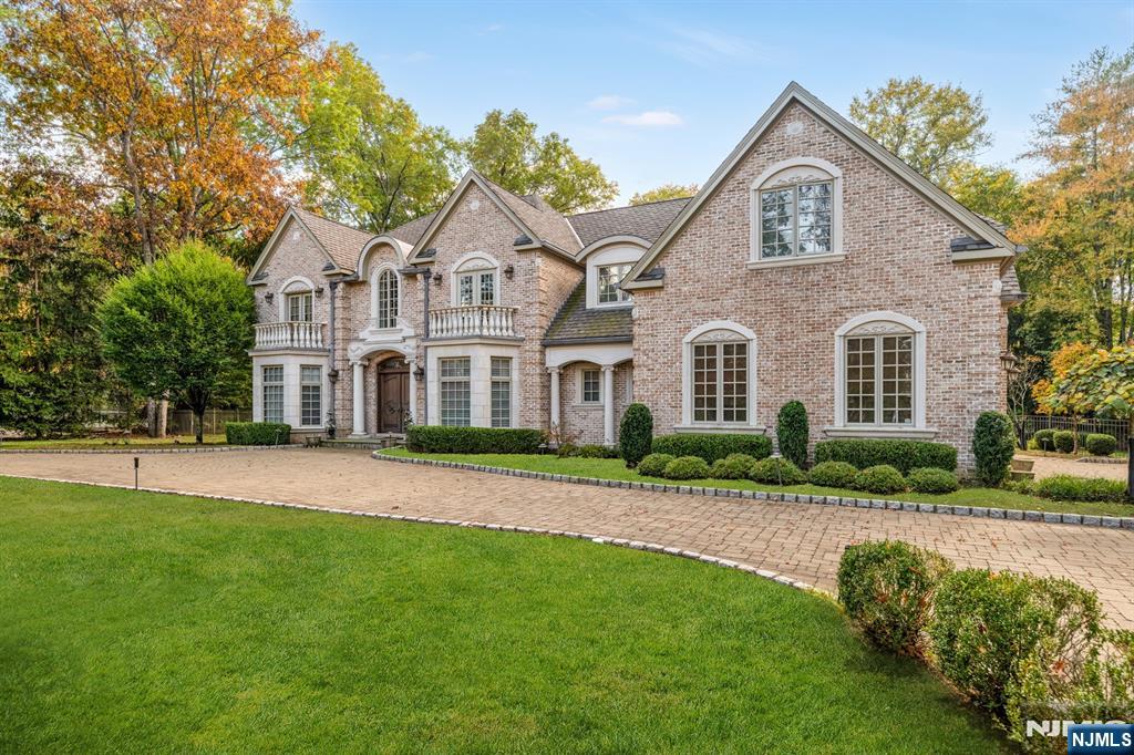 Nestled in the prestigious East Hill section of Upper Saddle River, this exquisite all-brick custom-built masterpiece embodies the perfect balance of luxury, craftsmanship, and modern comfort. Offering 5 bedrooms, 4 full bathrooms, and 3 half bathrooms, this regal residence exudes sophistication at every turn. Dramatic two-story foyer welcomes you to elegant formal spaces, adorned with intricate moldings and detailed trimwork throughout. The stunning columned dining room and richly paneled mahogany library set an elegant tone, while the expansive great room showcases a fireplace and custom millwork. The gourmet kitchen features professional-grade appliances, a large center island, and 2 dishwashers, and opens seamlessly to the inviting family room with 2nd fireplace. Luxurious first-floor primary suite offers a spa-inspired bath and custom closet, creating a serene retreat. Upstairs, a 2nd primary suite is joined by 3 additional en-suite bedrooms. Phenomenal lower level is an entertainerâ€™s dream with a home theater, gym, recreation rooms, ample storage, and a half bath. Outside, enjoy a resort-style oasis featuring a sparkling pool, outdoor kitchen, and multiple patios, ideal for both grand entertaining and relaxed leisure. Additional highlights include heated floors, integrated speakers indoors and out, plus a 3 car garage. This exquisite and regal residence is a rare Picasso gem, a true architectural masterpiece representing prime, elite real estate in Upper Saddle River.
