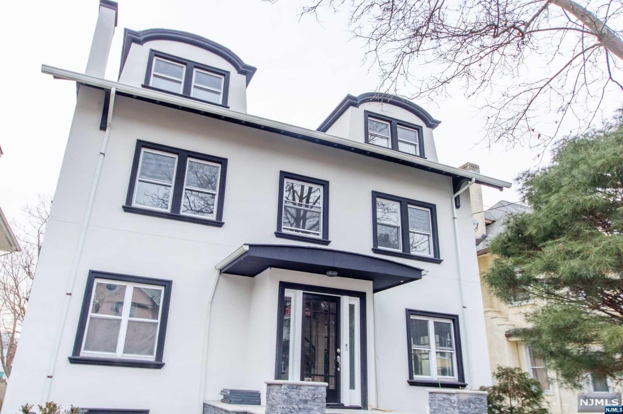BACK ON THE MARKET - PREVIOUS BUYER COULD NOT PERFORM! Premiere Location, Luxurious Style, and Modern Comfort. This beautiful home is located in the historic neighborhood of Forest Hills, just 2 blocks away from Branch Brook Park. This beauty has been modernized/newly renovated (2020) with over 5,000 sqft of living space on a quiet suburban street just blocks from the beautiful Cherry Blossom Land. A commuter's dream, this luxury home is located just minutes from the Light Rail. This luxury home has original stained glass windows, distinctive wood beam ceilings, pocket doors, and chandeliers. This home is one of the largest homes in Forest Hills and has eight (8) large bedrooms, along with four and a half (4.5) bathrooms and central air (2 zones).