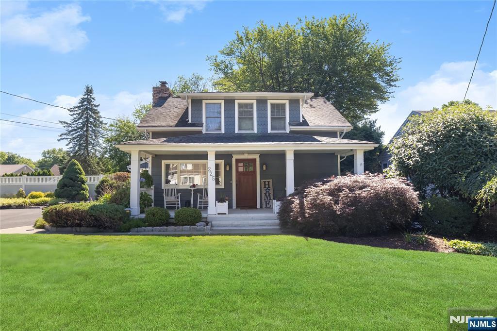 Welcome to this beautifully renovated & lovingly expanded Nantucket Colonial, just minutes from the picturesque downtown of Westwood. From the inviting covered & columned front porch & attractive vinyl siding to the renovated kitchen w/vaulted ceiling & skylights, this home is quite exceptional! The spacious living room is anchored by a classic wood-burning fireplace, creating the perfect gathering space, while the the beautifully vaulted ceiling kitchen/skylights features stainless steel appliances, abundant cabinetry, & a wonderful blend of country charm & sophistication. A Powder Rm is off the Kitchen. The main level also offers a spacious primary suite w/primary bth & double closet. An open staircase from the dining rm leads to the finished lower level, w/additional living space. The second floor features two bedrms, a full bath, & a home office/guest rm. The fully fenced property is beautifully landscaped creating an atmosphere of peace & privacy. An expansive deck overlooks the spacious rear yard, the attractive paver patio, & the picturesque oversized storage shed. An exterior entrance to the basement adds even more functionality. The oversized driveway provides exceptional off-street parking. Ideally located just minutes from vibrant downtown Westwood's boutique shopping, acclaimed restaurants, parks, & convenient NYC bus & rail, this exceptional residence offers the perfect combination of tasteful updates, a flexible floor plan, and an outstanding location.
