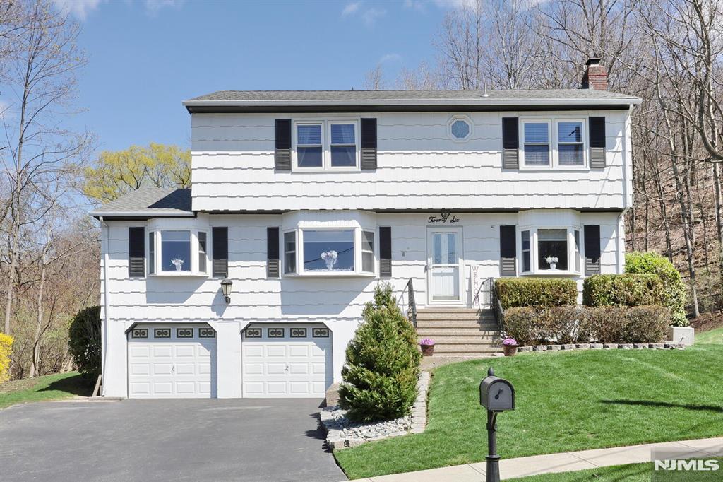 Welcome to this tastefully updated, well maintained 4-bedroom, 2.5-bath colonial nestled in one of Wanaque's most desirable neighborhoods. Blending classic charm with modern upgrades, this home offers the perfect balance of comfort, style, and functionality. Step inside to find a thoughtfully designed layout featuring spacious living and dining areas, ideal for both everyday living and entertaining. The updated kitchen serves as the heart of the home, showcasing stylish finishes, ample cabinetry, and seamless flow into the adjoining living space. A cozy family room with gas fireplace provides the perfect place to unwind, windows throughout fill the home with natural light. Upstairs, the generous primary suite offers a private retreat with its own full bath, complemented by three additional well-sized bedrooms and an updated hall bathroom. The unfinished basement leading to the garage is filled with untapped potential. While the home is set up to entertain, the private yard is the cherry on top. Outside, enjoy a beautifully maintained property with plenty of space for outdoor gatherings, relaxation, or play whether on the deck, by the patio/firepit area, or the in-ground pool- who needs to go on vacation with an oasis like this! Conveniently located near parks, schools, and commuter routes, this move-in-ready colonial is a rare opportunity to enjoy updated living in a timeless setting.