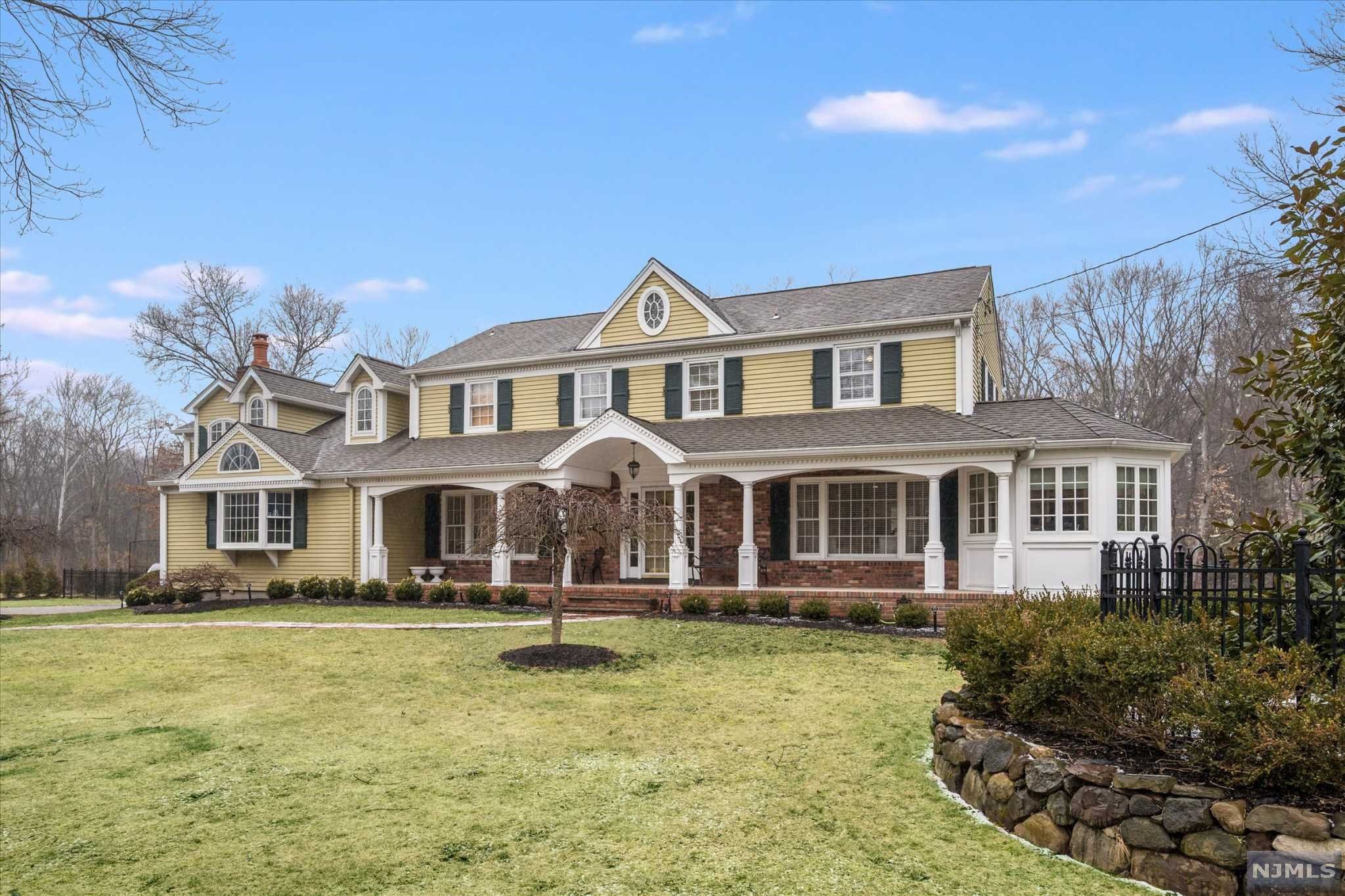 Welcome Home to this beautifully renovated center-hall colonial located in one of the most desirable towns in NJ! On a flat acre of property on a cul-de-sac lined with beautiful homes this immaculate home is light & bright with a wonderful layout! The terrific modern eat-in kitchen has an extra large island w/high-end appliances and flows nicely to the adjacent family room w/custom built-ins and cathedral ceilings. An oversized dining room with beautiful moldings and wet bar, formal living room, home office, atrium/sunroom, mudroom w/laundry and 2 powder rooms complete the first floor. Upstairs has 3 nicely sized bedrooms, and 2 full hall baths. It's completed by an expansive primary bedroom suite, w/walk-in closet, a separate sitting room, dressing area, and lovely primary ensuite. Finished basement with rec area, and plenty of space for gym/office/music room/storage. The backyard is expansive with tasteful new landscaping and a large patio ideal for entertaining. Move right in!