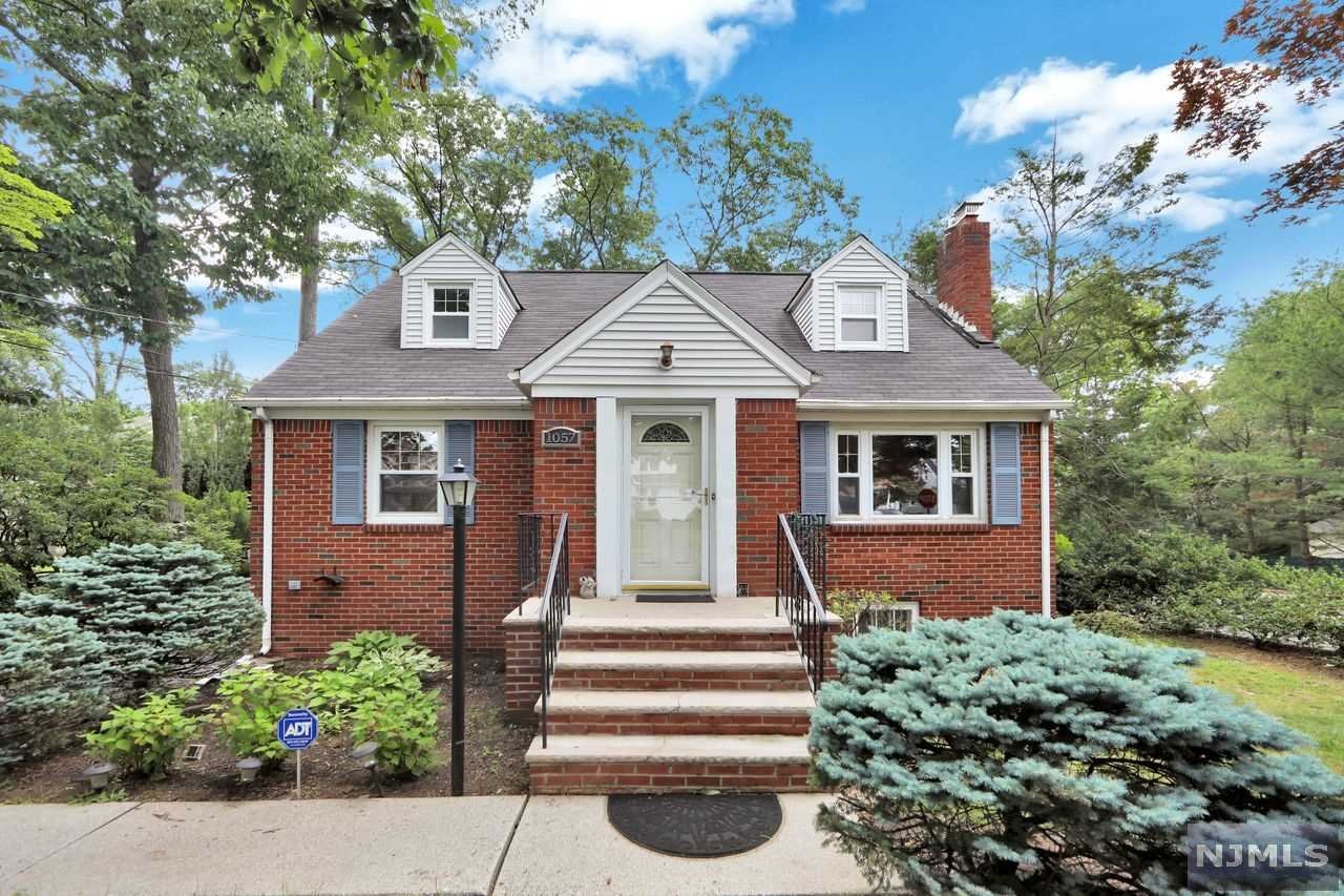 This beautiful Cape Cod is set on a large corner lot with white picket fence is great for extended living space. Enter into the Living Rm/fpl, Formal Dining Rm/office, Eat-In-Kitchen with door to spacious deck, bedroom and a full bath complete the 1st level. The 2nd floor features 2 large bedrooms with plenty of closet space and a full bath. There is a full basement partially finished with storage, laundry, and utilities. The driveway can fit 4+ vehicles. A detached, heated garage offers a BONUS LOFT with Living Rm, bedroom, and full bath. There is an above ground oil tank for the garage only; the house has gas heat. Close to transportation, parks, schools, shopping, and houses of worship. Solar Panels are owned.