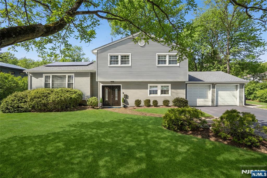 MUST SEE! Looking for a new home and want to offset the high operating costs? This is the home for you!! Newer SOLAR PANELS - built-in monthly savings equals lower utility bills! Nestled in a beautiful wooded setting in the Oldstead section-one of West Orangeâ€™s most desirable neighborhoods. Known for its tree-lined streets and unique family friendly atmosphere. Great cul-de-sac locationâ€“bright and cheerful turn-key classic 4 bed/3.1 bath split that backs up to a private reserve. Home offers hardwood floors, updated baths, gourmet Eat-in Kitchen with Kitchen Aid stainless appliances-Wolf Stovetop, custom solid wood kitchen cabinets, granite counters, breakfast bar, double ovens, and French door refrigerator. Sliders from dining room to a large oversized deck. Primary bedroom with ensuite updated bath. The ground level has the 4th bedroom/optional office, family room and sunroom. The lower level is perfect for rec rm/media rm/playroom with a full bath. The private lush flat backyard oasis with a large deck and fire pit is the perfect summer spot for relaxing and entertainmentâ€“ideal for Al Fresco dining, play and gardening. New Roof, New Hot Water Heater, New HVAC, Newer windows, and new siding. 2 Car garage and lots of parking. Convenient location to schools, shopping, highways, houses of worship and NYC transportation. This home strikes the perfect balance between tranquility and accessibility.