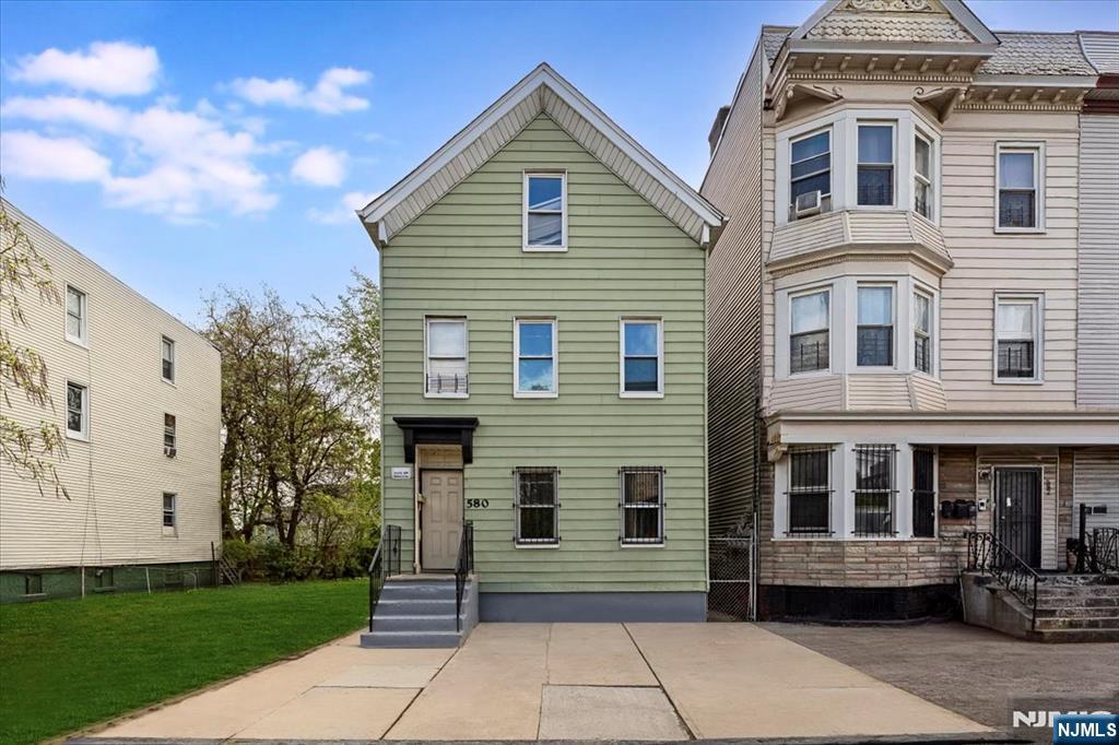 Unlock the potential of this versatile 4-bedroom, 2-bath property in Newark! This multi-level home offers a unique layout ideal for investors or buyers looking to customize their dream space. The first floor features a cozy one-bedroom unit complete with a kitchen, living room, and full bath perfect for extended living or rental income. Upstairs, the second unit offers two spacious bedrooms, a full bathroom, and access to a finished attic with additional bedrooms, providing plenty of room to grow. The home also includes an unfinished basement, offering ample storage or the opportunity to create additional living space. Being sold as-is, this property is a fantastic opportunity for those with vision. With some TLC, this home can truly shine donâ€™t miss your chance to transform it into something special!