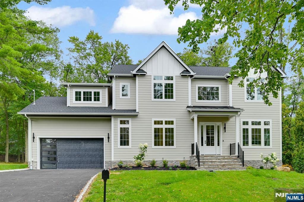 Welcome to this stunning NEW CONSTRUCTION colonial home, located in the desirable neighborhood on a quiet street. Set on approx Half Acres, this impressive 6-bedroom, 5.5-bathroom home offers 5,200 sf of luxury across three levels. The grand Double-Height foyer introduces the main level. Inside, the gourmet eat-in kitchen is a chef's dream, featuring custom cabinetry, a spacious center island, high-end appliances, quartz countertops, and a walk-in pantry. The family room flows seamlessly from the kitchen & includes an elegant electric fireplace and sliding doors leading to a large paver patio and expansive flat backyard ideal for entertaining. The first floor boasts 10ft High Ceilings, which also includes a formal living room, sophisticated dining room, guest ensuite, stylish powder room, and functional mudroom. Upstairs with 9' ceiling height has four generously sized bedrooms, including a luxurious primary suite with private balcony, spa-inspired bathroom featuring a soaking tub, stall shower, and dual sinks. One additional bedroom is en-suite while the other two share a full bathroom. A convenient laundry room completes this floor. The finished basement boasts impressive 9-foot ceilings and provides additional living space with a bedroom, private office or playroom, large recreation room, full bathroom with additional storage rooms. Modern smart home features and a 10yr reputable builder's warranty ensure peace of mind. Close to schools, major highways, parks and more.