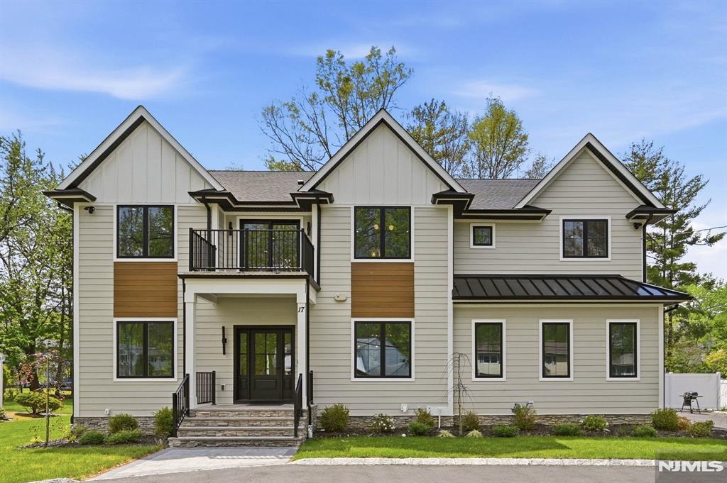 Welcome to this stunning NEW CONSTRUCTION 6-bedroom, 5.5-bath Center Hall Colonial offering over 4,600 sq ft of living space on a sprawling .35-acre NORTH-EAST facing flat lot in a prime Livingston location, walking distance to Collins Elementary School, complete with a circular driveway, fenced backyard ideal for a future pool, and an impressive covered patio designed for seamless indoor-outdoor living and entertaining. A welcoming front porch opens to a grand double-height foyer flanked by elegant formal living and dining rooms accented by custom trim throughout. The eat-in kitchen features custom cabinetry, quartz countertops, premium appliances, walk-in pantry, butlerâ€™s pantry, and oversized center island, flowing seamlessly into the dramatic 2-story family room with a striking tiled fireplace and sliders opening directly to the covered patio and expansive backyard. The first floor also offers a private en-suite bedroom, mudroom, powder room, and attached 2-car garage. Upstairs, the luxurious primary suite serves as a private retreat with its own balcony, spa-inspired bath, and oversized his-and-her walk-in closets. One additional bedroom is en-suite, while two others share a beautifully designed bath. A second balcony and laundry room complete the upper level. The finished lower level offers a spacious recreation room, media room, additional bedroom, and full bath. Conveniently located near NYC transportation, shopping, dining, and major highways.
