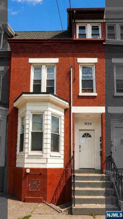 Welcome to this stunning brick brownstone nestled in the heart of Newark, NJ. This fully updated 3-unit multifamily exudes that coveted NYC and Jersey City brownstone charm, sitting on a 17.4x100 lot featuring a full basement and parking. Thoughtfully renovated in 2025 with modern finishes throughout, all three units are currently tenant occupied and generating consistent rental income from day one. Perfect for the seasoned investor seeking immediate cash flow or an owner-occupant looking to live in one unit while collecting rental income from the remaining two units. Experience the charm and character of classic brownstone living at a fraction of NYC and Jersey City prices with low 2025 taxes. Conveniently located with easy access to major highways and NJ Transit for a seamless commute to NYC. Property can be purchased individually or as part of an exclusive package deal with 4 additional side by side brick brownstones on S 12th St totaling 5 properties. Opportunities like this do not last. Schedule your showing today.