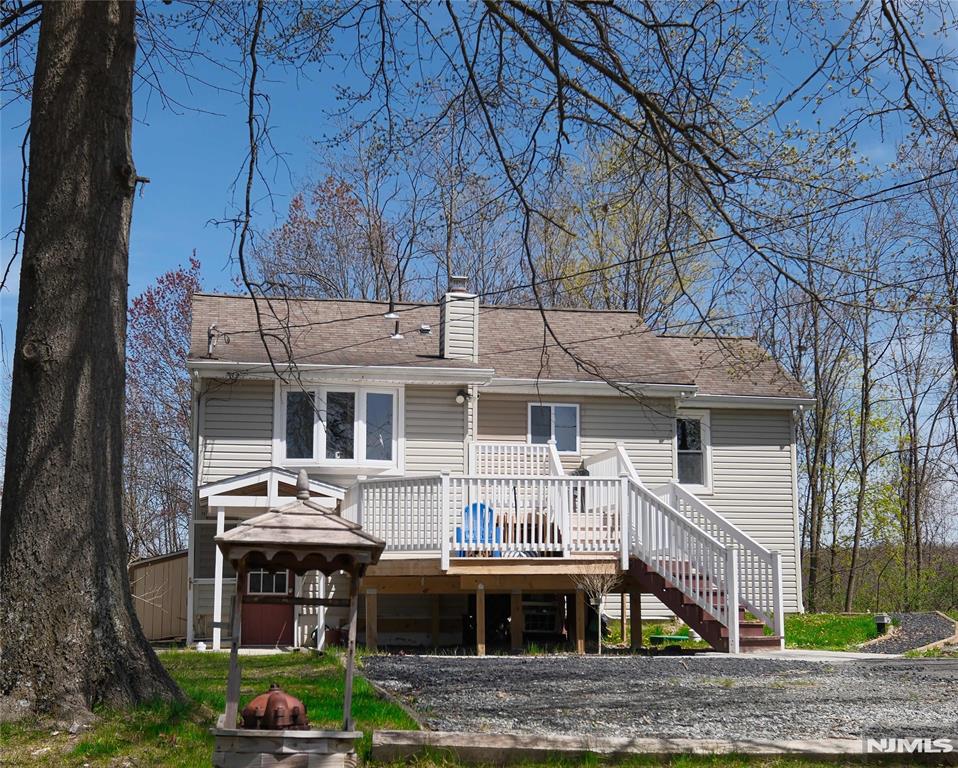 Here's a fantastic opportunity for an owner-occupied investment property or extended living. With seasonal lake views, this home sits down a quiet and peaceful country lane, yet minutes away from shopping, schools, parks, Greenwood Lake, and a bus into NYC. This top/bottom two family features two fully renovated three bedroom one bath units, each with central air and private decks. Septic is less than 4 years old. Turnkey two family homes are rare in this market, and this one is priced to sell!