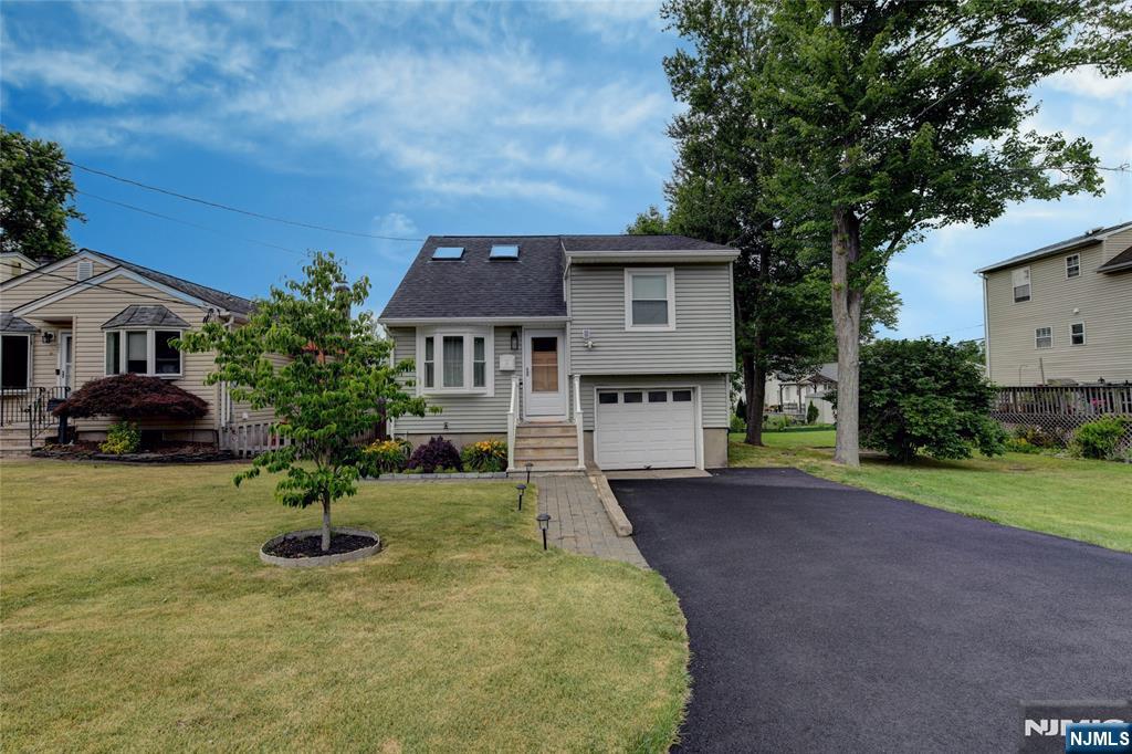 NO FLOOD! 2 bedroom, 1.5-bath split-level in desirable Lake Hiawatha with tons of upgrades! The main level feat. an open-concept LR, DR, & kitchen complete w/butcher block breakfast bar, spacious pantry, & door leading to the deck. 2nd FL offers a generous primary bedroom w/a WIC & a stunning, newly renovated Jack-and-Jill bath feat. a large walk-in shower & soaking tub. 3rd FL incl. a 2nd BR w/skylight & abundant storage. The walkout ground level boasts family room, stackable washer and dryer, half bath, & utilities. Outside, enjoy the mostly fenced yard w/patio & storage shed. Addtl. highlights incl. HWF, central air, tankless water heater, water softener (owned), ceiling fans, & numerous recent upgrades, including roof, deck, HVAC system, & more! (see MEDIA for complete list of upgrades). ONE YEAR HOME WARRANTY INCLUDED!