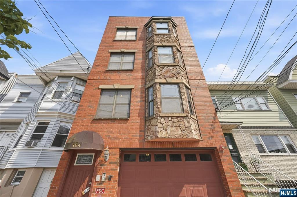 Introducing this beautifully maintained 3-bedroom, 2-bath condo offering over 1,330 square feet of bright, spacious living with the rare convenience of garage parking in one of Union Cityâ€™s most desirable locations. Just moments from Washington Park, shopping, schools, restaurants, and direct NYC transportation, this home combines comfort, style, and everyday convenience. The expansive open-concept living and dining area is filled with natural light from multiple exposures, creating an inviting space for relaxing or entertaining. A versatile office nook or play area adds flexibility, while the modern kitchen features stainless steel appliances, ample cabinetry, and an oversized breakfast bar perfect for casual meals and gatherings. Privately tucked down a long hallway, three generously sized bedrooms provide a peaceful retreat from the main living spaces. The oversized primary suite includes a walk-in closet, en-suite bath, and private terrace overlooking the backyard. Natural light pours through the charming front bay window and rear terrace doors, enhancing the home's warm, airy feel. Additional highlights include an in-unit washer and dryer, extra garage storage, and the spacious layout of a true three-bedroom home. This exceptional Union City residence offers the perfect blend of space, functionality, and easy access to everything you need.