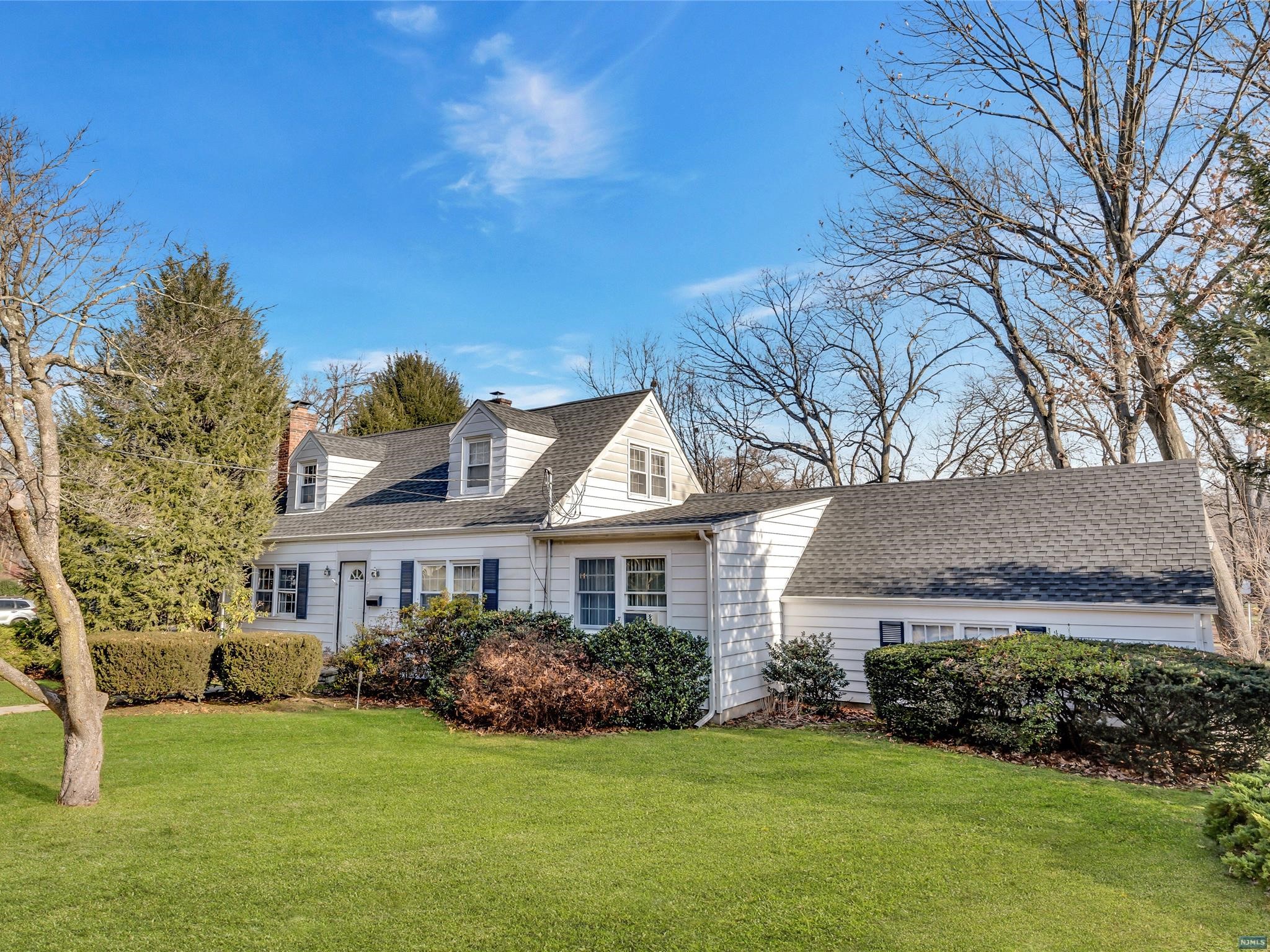 Situated on a sought after location near Memorial Park, this lovely 3 Bedroom, 2 Bath Expanded Cape Cod home has been lovingly cared for. Highlights include a spacious Living Rm w/beautiful brick wall surrounding the fireplace, sunny & bright banquet sized Dining Rm, which accesses the Family Rm w/sliding glass doors to deck. The updated kitchen boasts Silestone countertops, newer appliances, ceramic tile backsplash & counter seating. The Bedrooms are great sized & offer good closet space - first floor Bedroom could also be used as a primary. In addition, there is an attached garage w/entry, a new roof (2 yrs), above ground oil tank, furnace approx 11 yrs, a finished Rec Rm in basement, featuring an office w/full bath/stall shower, closet, plenty of storage & utility/laundry rm. Close to Roosevelt ES, RDMS & RDHS, NYC trans & Van Saun Park. Desirable RE School Sys & Community. This location is truly a delight-you will love it!! Please note agent remarks & showing instructions.