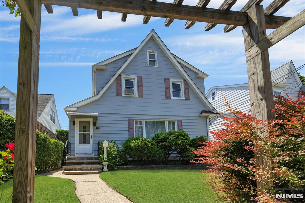 Sunny and bright colonial located in a quiet, friendly neighborhood, with easy commute to NYC and walking distance to 3 shopping centers. The 1st fl. features a large Liv.Rm, Open Kit. to Dining Rm. w/sliders to a covered deck, great for entertainment rain or shine. The spacious backyard including a storage shed & attached deck, making it perfect for those summer gatherings. The 2nd fl. consists of 2 good size bedrms. and a smaller bedrm. w/ access to the large attic for extra storage and an full bath. The basement, consists of full bath, kitchenette and two room, which is perfect for extended family, guests or home office. The 1- car detached garage provides a driveway for 2 add'l cars. Bring your style and vision to create your perfect home.
