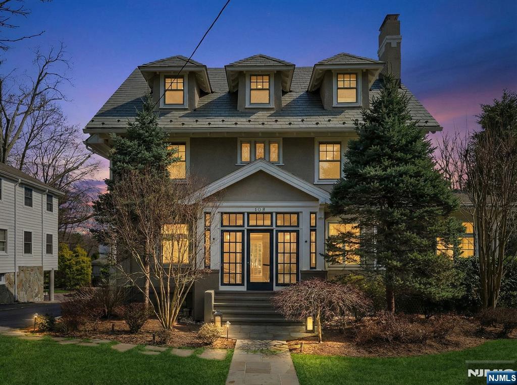 Ideally located just a block from Maplewood Village, this beautifully updated 1910 Colonial set on an expansive, professionally landscaped property that seamlessly blends timeless character with modern upgrades. Original details include leaded glass windows, French doors and impressive millwork throughout. Featuring a gracious double living room with a gas FP, leading to a generously sized DR that's ideal for entertaining. A dedicated office provides 2 built-in workstations & extensive custom bookcases. The kitchen, outfitted w large center island, prof-grade appliances, three sinks and a walk-in pantry, opens to a sun-filled FR designed for everyday living & hosting, while nearby mudroom, PR & FB complete this level. Upstairs, an expansive primary suite with gas fireplace, walk-in closet and spa-like bath, is complemented by four additional bedrooms, one and a half additional baths, convenient second floor laundry and a family room that opens to a private sundeck. Downstairs, the spacious lower level includes a Universal Gym, game room and ample storage. Outdoor living is equally impressive, showcasing a heated in-ground pool w underwater lighting, a fully fenced backyard and beautifully maintained grounds with irrigation and landscape lighting. Additional features include a two-car garage with EV charging, owned rooftop solar panels and a comprehensive smart home system controlling thermostats, lighting, and five-zone audio throughout the home and outdoor spaces.