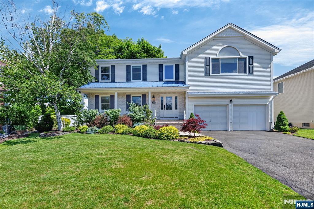 Welcome to 690 William Bliss Drive, a 4-bedroom, 2.5-bath colonial set on a quiet horseshoe-shaped street with only a handful of homes offering rare privacy in one of New Milford's most desirable locations. A dramatic 2-story foyer entry welcomes you home. To the left, a living room flows seamlessly into a formal dining room, leading into a modern, updated eat-in kitchen featuring an island and ample space for gathering. The family room with fireplace opens via sliders to a brand-new Timber-Tech deck and backyard. A half bath and 1st floor laundry complete the main level. Upstairs, 4 generously sized bedrooms include an oversized primary suite with a large private bath. Full basement offers endless potential. 2-car garage. Underground sprinkler system. Built mid-90s and meticulously maintained. Conveniently located near top-rated schools, parks, houses of worship, and NYC transportation.