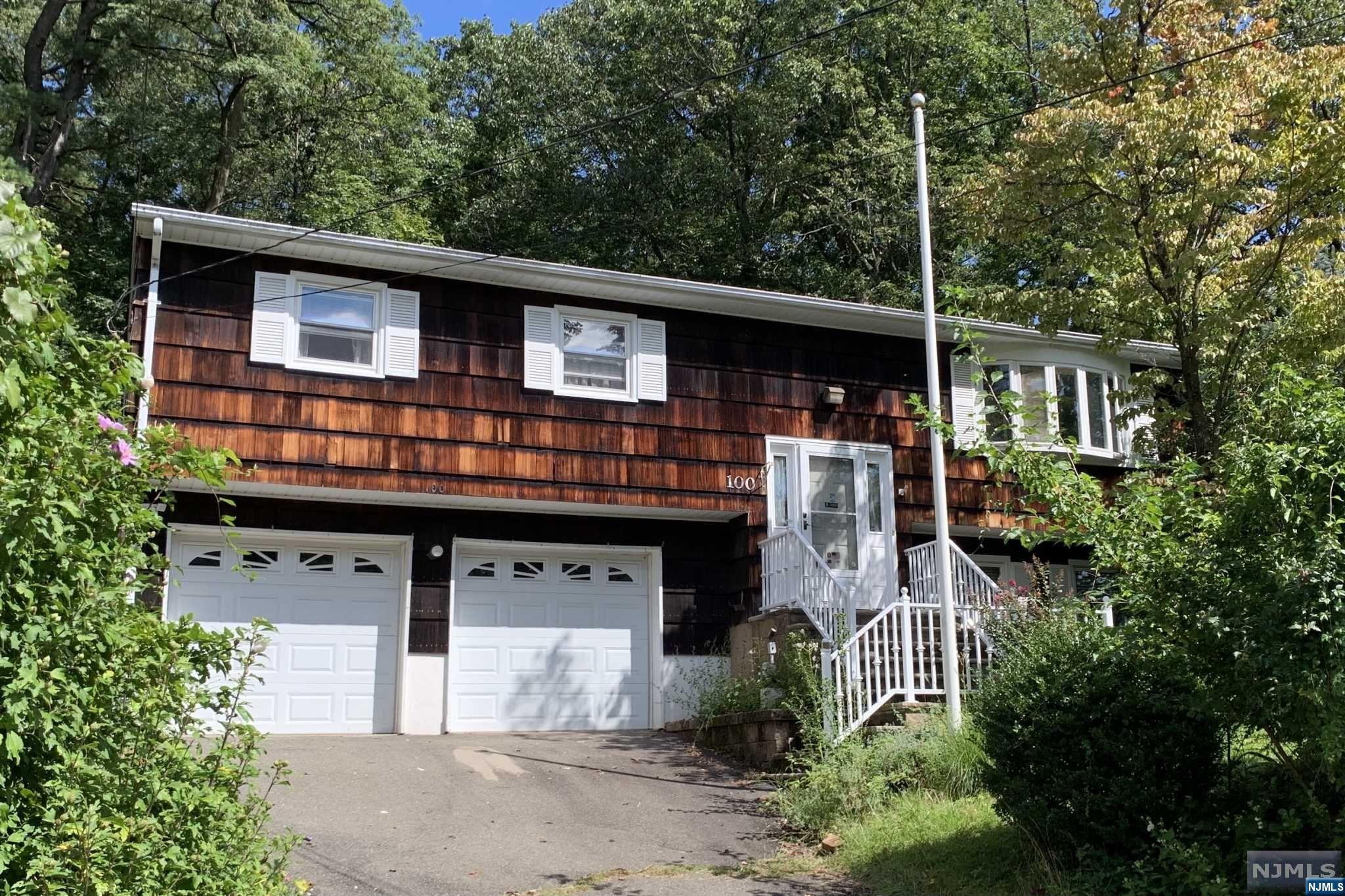 Outstanding 4 bedroom bilevel with a 2 car garage and sunroom! This super home features a living room with a newer bay window, eat in kitchen with dishwasher, paddle fan and tile floor. The master bedroom suite has a walk in closet and bath. The lower level family room has built in shelves, there are newer windows throughout, central A/C, 2 zone hot water baseboard heat and a 3 year old natural gas furnace. There is a carpeted three season sunroom with a paddle fan leading to the 18 X 10 deck and fenced yard.