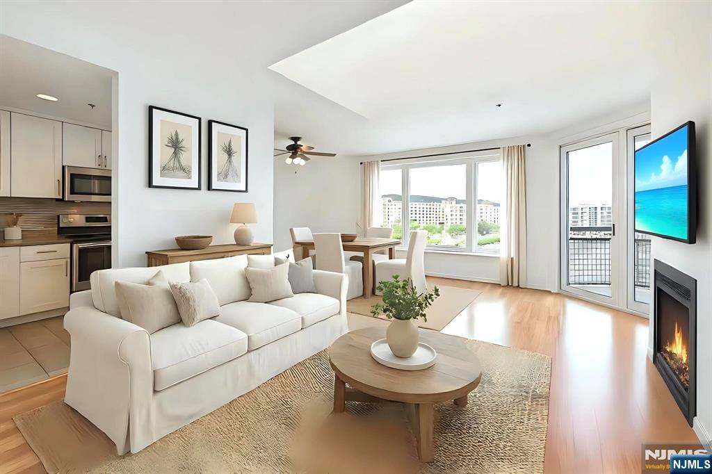 A rare chance to own a 3-bedroom, 3.5-bath duplex in the prestigious waterfront duplex on the Gold Coast. This beautiful home showcases sweeping views of the Manhattan skyline and Hudson River. Features include a wood-burning fireplace, double height skylight and in-unit washer/dryer, blending comfort with elegance. Enjoy 24-hour concierge service, a state-of-the-art fitness center, heated indoor pool, and garage parking. Perfectly located near Whole Foods, fine dining, shopping, and multiple commuting options including the NYC Ferry, Light Rail, and bus. Experience luxury waterfront living just moments from Manhattan. A great opportunity, donâ€™t miss your chance!