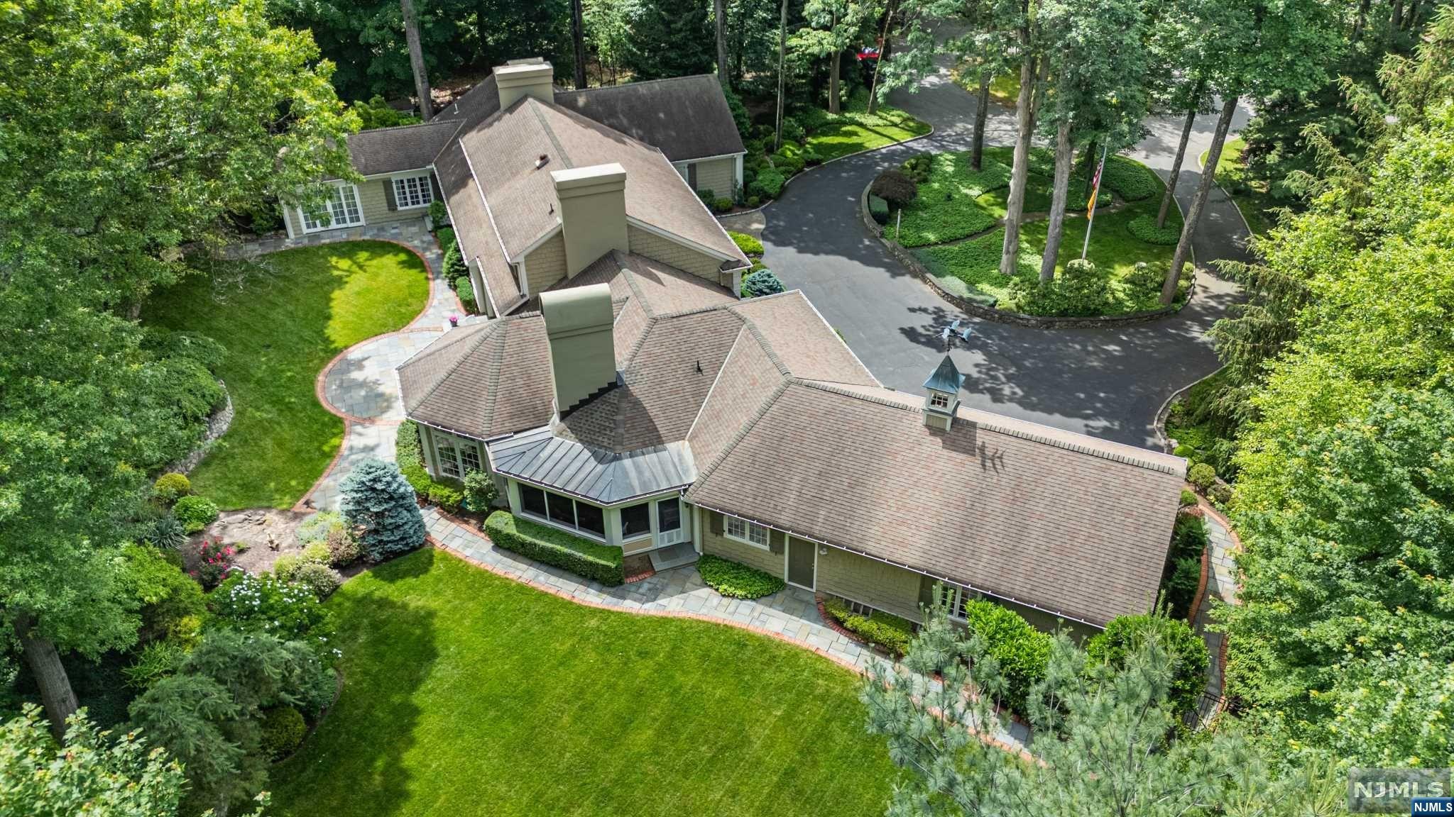 Nestled at the end of a tranquil cul-de-sac, this sprawling ranch offers a serene retreat on a lush 2.2-acre property. It features an open floor plan, high ceilings, hardwood floors, a gourmet kitchen, and a luxurious primary suite. Private walking trails and a spacious patio enhance outdoor living. Conveniently located near top-rated schools and amenities, this home is a perfect blend of comfort and style.