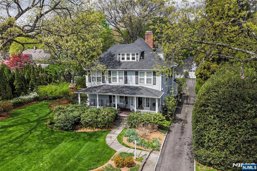 The Classic Ridgewood Colonial Farmhouse with a twist. Set back from the road beyond a lush lawn evokes charm and comfort while providing all the modern amenities for the way we live today. Stunning newly renovated kitchen features an enviable Scullery, fully outfitted with oversized fridge, freezer, dishwasher, oven & prep sink. A cook's dream come true. Primary suite features a Walk in Closet, Primary Bath and a spacious, Private Terrace overlooking the expansive property complete with Heat & a Fire Pit. A huge, renovated Two Car Garage/Barn Set on an exquisite (125' x 275' /0.79 acre) level, gated property big enough for a ball game, a pool, or a tent for spectacular outdoor entertaining. Rare in Ridgewood to find a house of this caliber on such a magnificent piece of property. Top notch location, stroll to the train station, Whole Foods, and Ridgewood's vibrant downtown area with so many fine Restaurants and Shops. Ridgewood is known for its Excellent School System, Award Winning Library, First Class Recreational Opportunities and close proximity to New York City. Your forever home, Don't hesitate on this one!