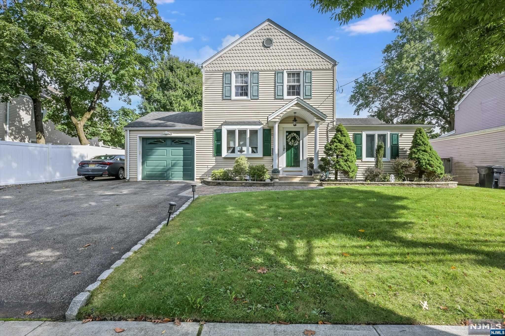 This well-maintained 2-bedroom (with possible 3rd), 1.5-bath home in Paramus is perfect for comfortable living. The first floor includes a spacious living room, eat-in kitchen with oak cabinets and granite countertops, a large dining room, family room, and a half bath. Upstairs, you'll find the primary bedroom, a second bedroom, and a full bath. The home features hardwood and tiled floors, along with a fully finished basement offering a walk-in closet, laundry, and utilities. Recent updates in 2022 include a new furnace, hot water heater, A/C, and 200 AMP service. The fully fenced yard is ideal for entertaining, with a 1-car garage and parking for three more vehicles. Convenient access to major highways. Sold AS-IS with no known issues. QUESTIONS CALL LA Leta DeMatteo 201-446-3566