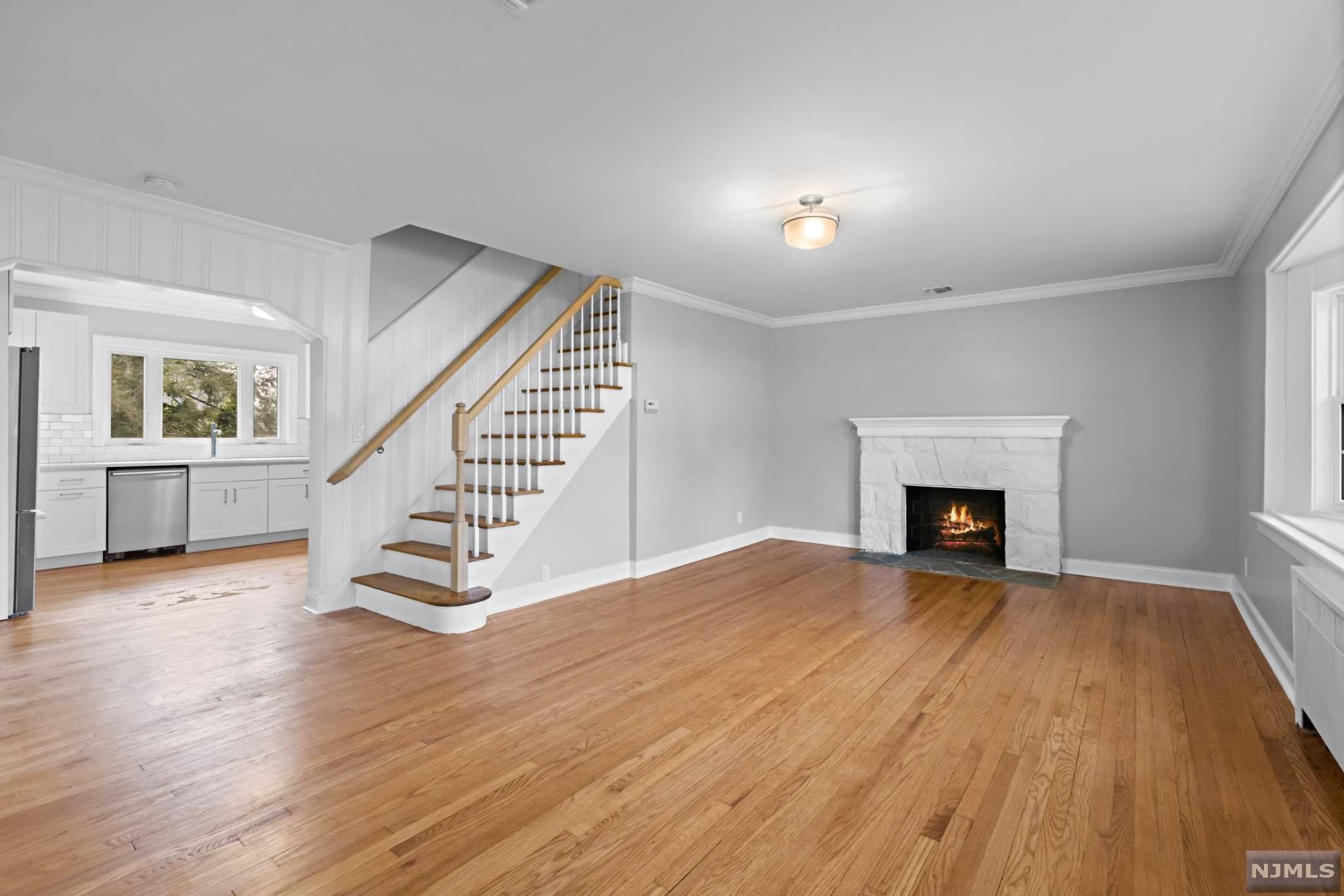 Welcome home to this completely reimagined Tudor. This 4 Bedroom, 3.5 Bath home sits on a fantastic Corner lot over looking Crystal Lake Park, which can be taken in from the In ground pool. With all the amenities for modern day, hardwood floors, quartz counters, Wood burning Fire place and finished basement with custom built bar perfect for entertaining. Minutes from NYC.