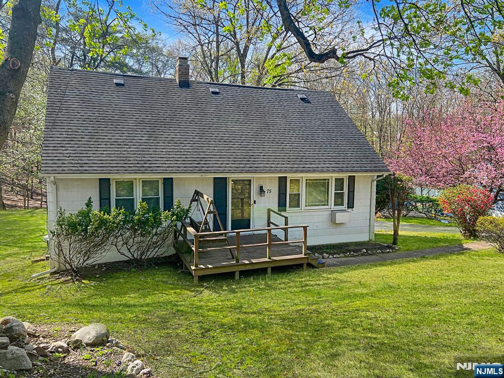 Welcome home to this lovingly maintained 4 BR, 2 BA cape in Oakland. The bright and welcoming living room features a picture window, hardwood floors, and space for entertaining. The kitchen offers loads of potential while the dining room opens to the deck with great views of the expansive backyard. The first floor is complete with 2 bedrooms and a full bath. Upstairs you'll find 2 more generous sized bedrooms, another full bath, and attic storage. The finished walk-out basement has a wonderful rec space with a full bar, laundry, and utility area. Outside enjoy the deep private backyard, oversized 2 car detached garage, deck with carport underneath, and ample parking on the newly paved driveway. In addition, a brand-new septic was just installed! This house is in a prime location close to parks, schools, transportation, highways, and shopping. This gem won't last long. Come make it yours and unlock the endless possibilities.