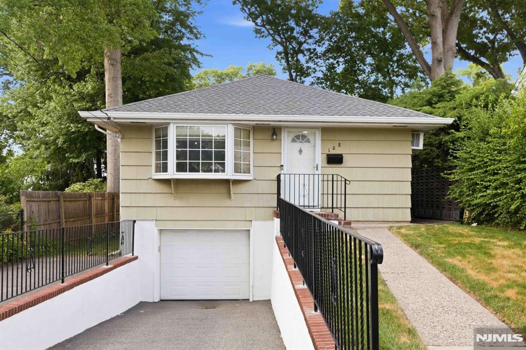 Move right into this 3-bedroom home featuring hardwood floors, updated kitchen and bath, and a fully finished basement with half bath. The lower level offers flexible space for a home office, gym, or whatever you can imagine. Recent improvements include a brand-new roof. One-car attached garage with interior access. Enjoy the private backyard and convenient location close to schools, parks, and transportation. Don't miss this move-in ready opportunity!