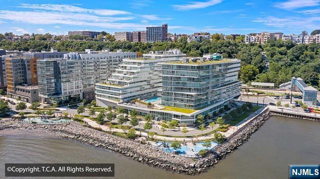 (Contact NELSON CHEN at 2 0 1 - 8 8 6 - 8 0 0 0) - AVORA a Port Imperial - Welcome to Residence 507. This southern 2-Bedroom has 1051-SF plus a full length glass-walled terrace with beautiful Hudson River & Manhattan views. Stylish interior finishes include gorgeous wood floors, porcelain tile, quartz waterfall counters, quality appliances and lovely fixtures. Building amenities include 24-hour concierge service, health club, media room, sports simulator, resident lounges and the amazing 3rd floor pool deck & barbecue patio. NY Waterway Ferry service, Hudson/Bergen Light Rail & NJ Transit Bus service are literally steps from the lobby door. DUE AT LEASE SIGNING: 1st Month Rent, 1.5-Month Security Deposit, $300 moving day fee to the building. No smoking is allowed. - (Presented by THE CHEN AGENCY 2 0 1 - 3 4 6 - 8 8 8 8, N e l s o n @ C h e n A g e n c y . c o m)