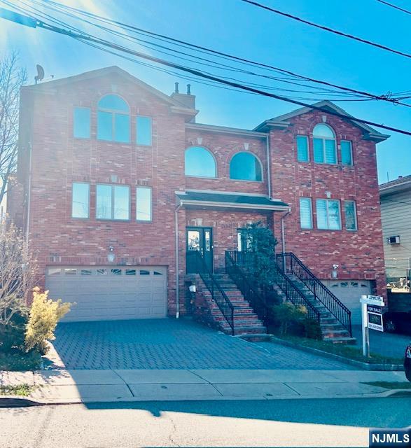 Well built by a reputable builder on 75 X 100 lot with 4 Bedrooms on 2nd Fl. + bonus 5th bedroom or family room on 1st Fl. with 9 feet high ceiling. The unit has an open layout living room and kitchen, walk out patio, marble bathrooms, 2 fire places and true 2 car garage