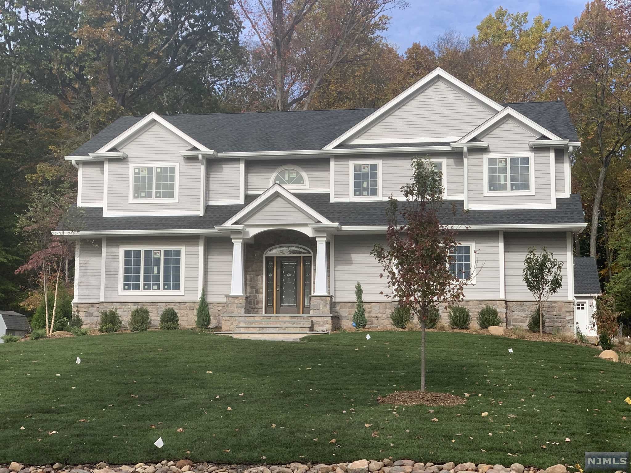 Beautiful and Elegant New Construction Spacious Home with Approximately 4800 SqFt. on an oversized Large level Lot. Features include Entry Hall with Formal Living Room, Formal Dining Room with Gas Fireplace, Eat in Kitchen Central Island with top of the line Appliances with Separate dinette, Study / Office & Powder Room. Entry to 2 car oversized garage with 12 ft ceilings. The second floor: Master Bedroom suite with WIC and a Full Master Bath, Bedroom with wic and its own Bath and 2 additional Bedrooms with Jack and Jill Bath and their own WIC in each room. Stair to the Attic. The Basement is full and finished. There is an additional 2 car Detached Garage with a loft that will be great as an Art Studio. Amenities include Hardwood Floors, 2 zone A/C and 4 Zone Baseboard Heat, Close Commute to all Major Highways, Shopping and Malls. Luxury at its Finest.