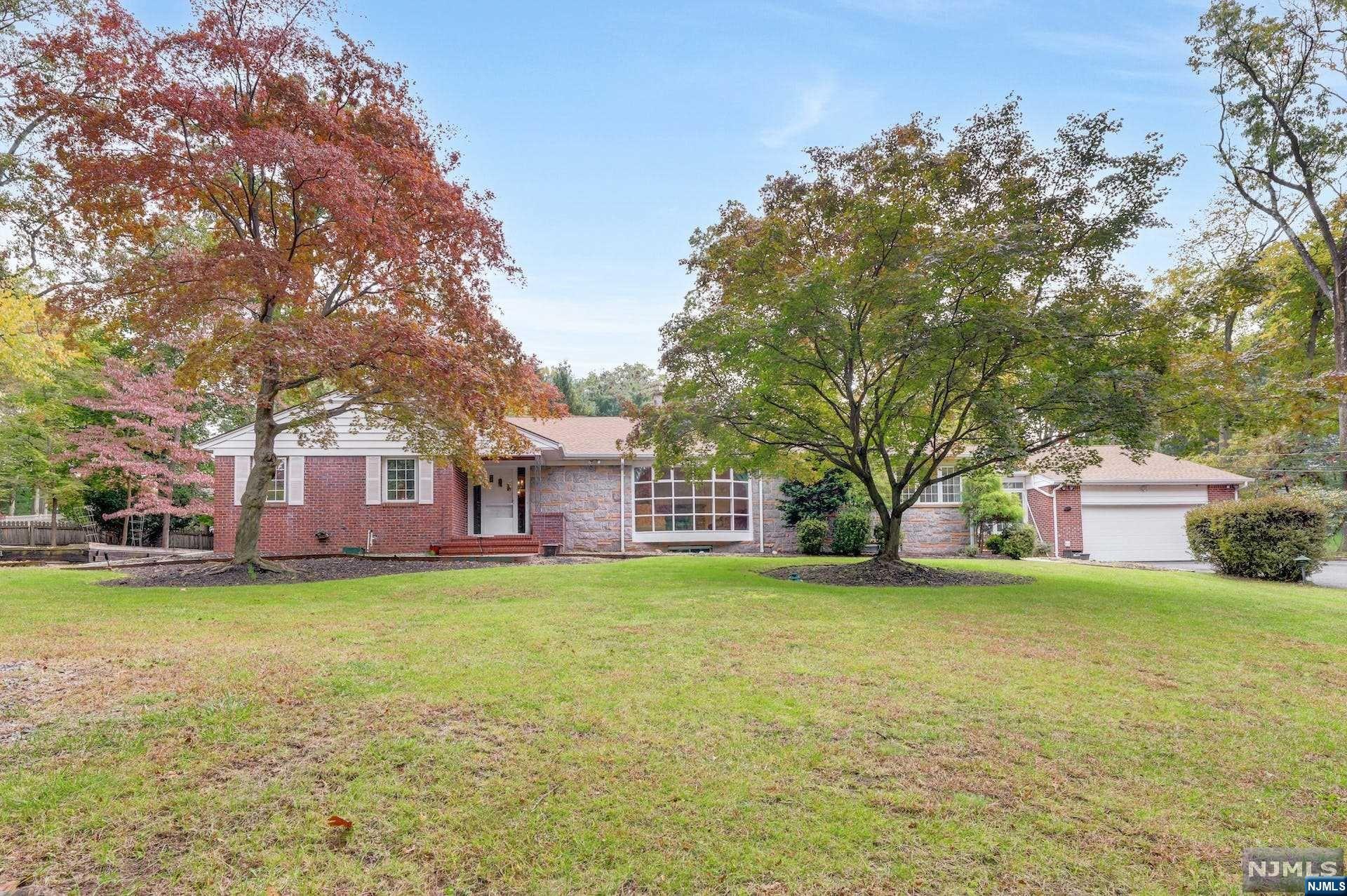 Located in Sought After Multi Million $ Neighborhood. Bordering Ho-Ho-Kus. Tucked away from the road! This Custom Ranch is truly one of a kind! Fantastic layout, all bright Large rooms. Over 3400SF approx. on main level alone, PLUS FULL NEWLY FINISHED BASEMENT! Main Floor has a fantastic layout with separated Primary BR w/bath & walk-in closet. Huge Living Rm W/FPL opens to large Dining Rm. Eat-In Kitchen opens to Great Rm overlooking backyard as well as Separate Rec Rm. 2nd Front entry leads to Breezeway/Sun Rm with second FPL. 3 addtl HUGE BR's & access to backyard patio. The Property & the home has a ton of space & potential. Downstairs is FULLY RENOVATED gorgeous Rec Rm with mosaic tiled Wet-Bar & all the space you could need ! Excellent layout for extended family. Tennis Ct (As Is) & Bocce Ball Court. This is one house you can't judge from the photos, you MUST see it in person! Its Almost impossible to find well build Custom Ranches Like This one!!