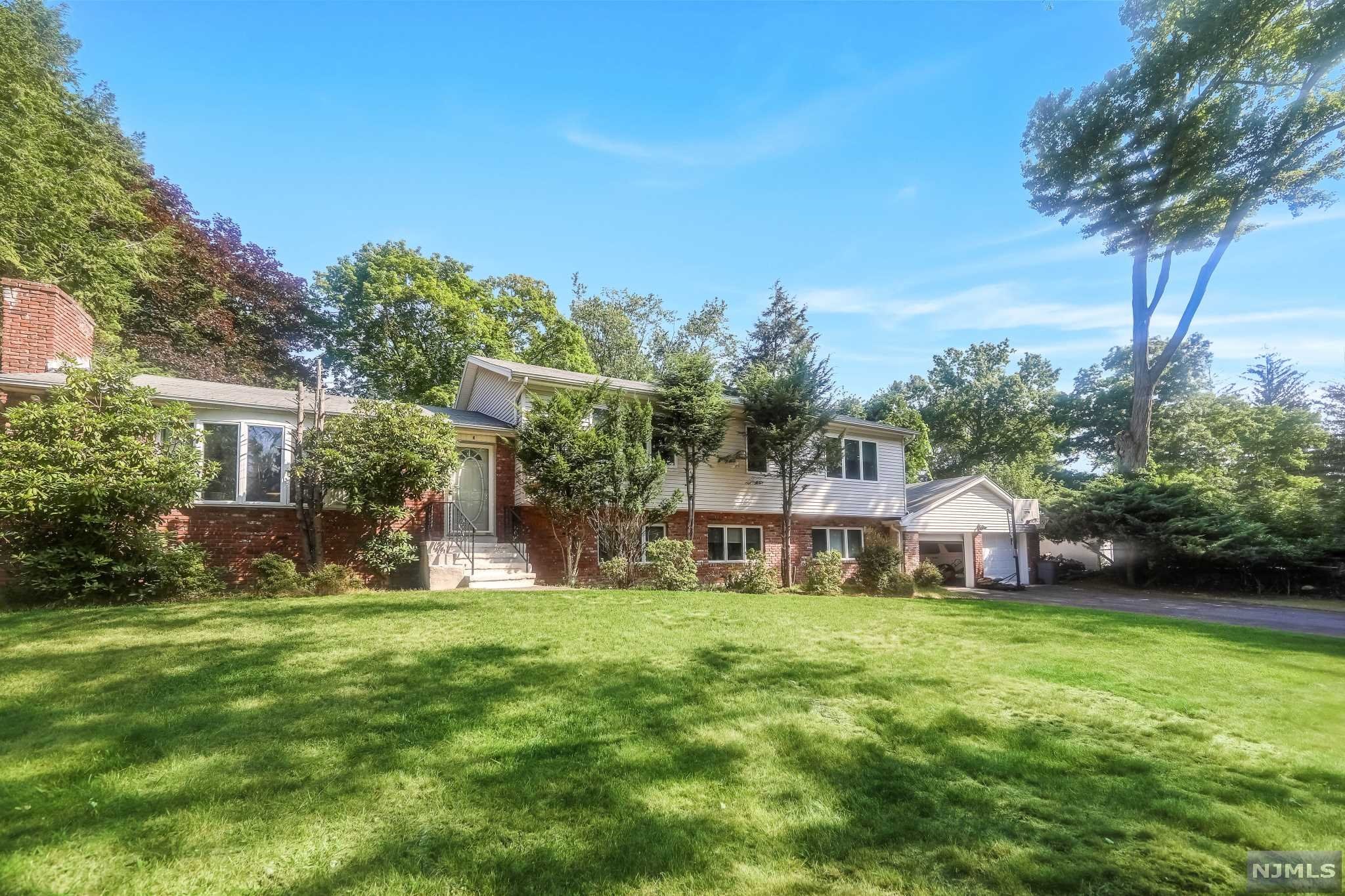 Incredibly spacious and expanded split level home perfectly located! Beautiful and large back yard fully landscaped and fenced in. In ground pool and large deck off of kitchen. Fully finished basement with full storage room, fireplace, and and tons of space.