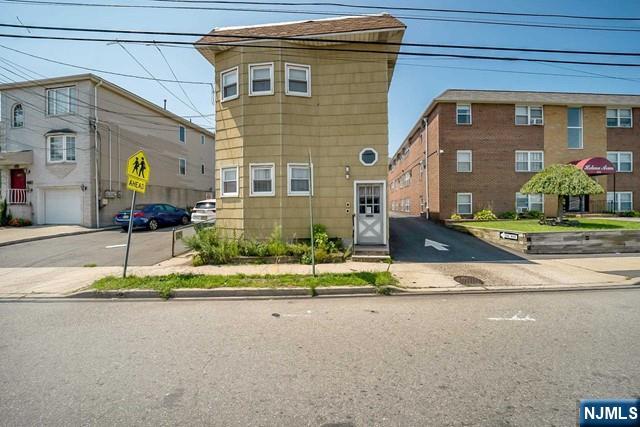 2 family investment opportunity w/3 parking spots. Each unit features Living/Dining rm combo, kitchen, 2 bedroom, bathroom. 2 separate gas hot water baseboard heating systems, 2 hot water heaters, separate gas & electric meters. Both units Tenant occupied. 3 assigned spots behind deck marked A-B-C are for exclusive use of this house, balance of parking spaces/Rear part of lot is an easement on deed used by building next door. No grass to cut! Full unfinished basement with laundry hook ups and storage, deck off rear of house. Electric panels are Federal Pacific- Seller will not replace. 2 blocks to NJ Transit bus #40 to Harrison PATH, 1 block to shopping.