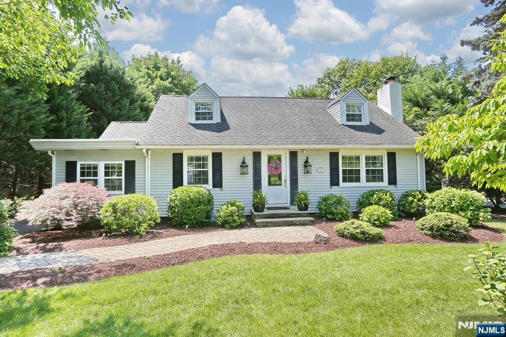 WELCOME TO THIS DELIGHTFUL HOME IN GLEN ROCK,, NJ. THIS BEAUTIFULLY UPDATED COLONIAL CAPE ON A LARGE LOT, HAS MUCH TO OFFER. THE FIRST FLOOR HAS A MODERN EAT IN KIT WITH AN ISLAND THAT SEATS 5, AND HAS SS APPLIANCES.THE KITCHEN DOOR LEADS DIRECTLY TO AN OVERSIZED PATIO AND A LG PRIVATE YARD.THERE IS A LARGE 2 CAR GARAGE WITH A WORK BENCH AND LOFT STORAGE, WHICH IS IDEAL FOR ALL YOUR OUTDOOR SUPPLIES. ALSO ON THE FIRST FLOOR,. ENJOY THE LR WITH A WONDERFUL WOOD BURNING FIREPLACE-,DINING RM, UPDATED FULL BATH AND A LARGE BEDROOM, THERE IS ALSO A MUD RM/SUN RM/OR OFFICE WITH A SEPARATE ENTRANCE.. THE SECOND FLOOR HAS TWO KING SIZE BEDROOMS, EACH HAVING TWO LARGE CLOSETS AND STORAGE..THERE IS ANOTHER FULL REMODELED BATH UPSTAIRS, WITH A CLOSET FOR HOLDING TOWELS AND ESSENTIALS. THERE IS ALSO ADDITIONAL ATTIC STORAGE SPACE ! THE LIGHT AND BRIGHT BASEMENT IS FINISHED WITH RECESSED LIGHTING AND A LAUNDRY AREA AND STORAGE AREA. THE PROPERTY IS LOVELY AND QUITE LARGE WITH BEAUTIFUL DOGWOOD TREES IN THE SPRING, AND AN ABUNDANCE OF HYDRANGEAS AS WELL.. THERE IS A NEW BOILER AND SPLIT AC/HEATING SYSTEM THROUGHOUT THE HOUSE , WHICH WAS INSTALLED IN 2025. WALK TO SCHOOLS, NYC TRANSPORTATION, 2 TRAIN LINES AND,A BUS AND WALK TO THE DOWNTOWN AREA WITH LOTS OF GREAT RESTAURANTS...WE HAVE A POOL, A DOG PARK, LOTS OF ACTIVITIES AND ONE OF THE BEST RATED SCHOOLS !! CALL NOW FOR A PRIVATE VIEWING, YOU WILL NOT BE DISAPPOINTED !! FYI, THE REAR OF THE PROPERTY GOES ALL THE WAY BACK TO THE BLACK FEN