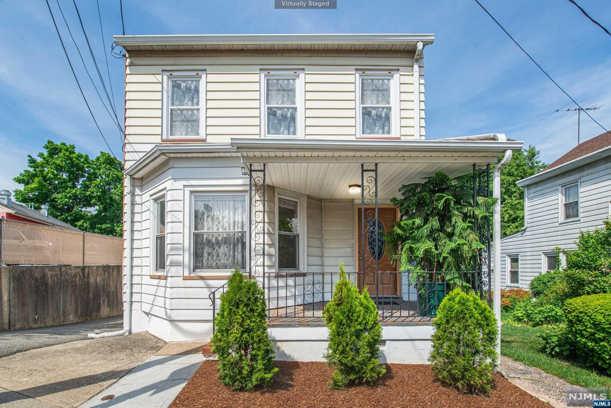 Looking for the property that will assist you in paying your mortgage? This is it! The 1st floor unit features 2 Bedrooms, a Living Room streaming with natural light, a formal Dining Room, Eat in Kitchen, & a Full Bath. Enter the 2nd unit & you will be greeted to an open floor plan. Imagine preparing your favorite dish in the Eat in Kitchen while your guests enjoy a glass of wine in the inviting Living Room/Dining Room area. The unit is made complete with 2 Full Baths, a Bedroom offering ample closet space, & a finished attic with Office/Recreation Room. Separate utilities for each apartment. Full Basement with Laundry facilities. Car lovers will appreciate being one of the only 2 Family Homes in the area that offers an oversized driveway & 3 Car Garage! Close proximity to schools, parks, shopping, public transportation, highways & EZ access to NYC.