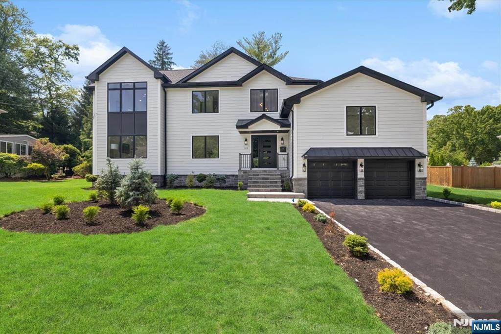 Welcome to this stunning, fully renovated home located in one of Oradell's most desirable neighborhoods. Thoughtfully redesigned with exceptional craftsmanship and high-end finishes throughout, this spectacular residence offers the perfect blend of luxury, comfort, and everyday functionality. A grand entry foyer welcomes you into a bright, open floor plan filled with natural light and beautiful custom woodwork. The heart of the home is the designer kitchen, featuring premium appliances, impressive waterfall center island, custom cabinetry, and elegant finishes, making it ideal for both everyday living and entertaining. The home offers five spacious en-suites, including a luxurious primary suite, along with a 1/2 bath designed with today's modern style in mind. Step outside to your private backyard retreat featuring a large, fenced yard, Trex deck, and covered patio; perfect for outdoor dining, relaxing, and entertaining all season long. Located in the highly sought-after town of Oradell, this exceptional home is served by a phenomenal school system and offers easy access to major highways, as well as convenient NYC commuting via both train and bus. This is a rare opportunity to own a move-in-ready home in one of Bergen County's most desirable communities.