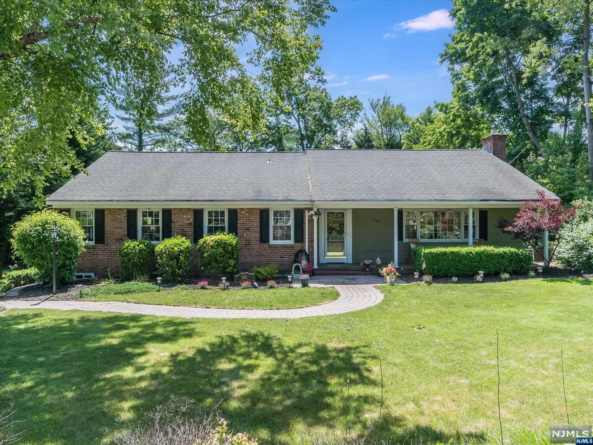 Spacious raised ranch nestled on.40 acres of outdoor paradise. Offering 5 bdrms, office, & 4 baths, this lovely home provides fabulous living options & ease of entertaining. Brand new kitchen boasts quartz counters, crisp white cabinets, beverage station, breakfast area, & huge pantry for all your needs. Lg living rm is punctuated w/wood burning fplc flanked by built-ins while dining rm opens to outdoor oasis w/ multi level patios, heated salt water pool, & soothing rock waterfall. Den/office, gorgeous hall bath w/bubble tub, bdrm, & primary suite offering 2 walk-in closets complete the 1st floor. 2nd level has 3 additional bdrms, full bath, & exceptional attic storage. Descend to beautifully finished lower level, ideal for hosting w/custom wet bar & generous family room perfect for relaxation. At grade level it provides convenient outdoor access, full bath, & entry to oversized 2 car garage. Located just minutes from Glen Rock & Ridgewood trains, it makes NYC commuting a breeze.