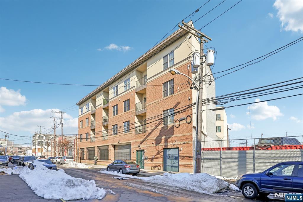 Welcome to Austin Villa Condominiums! Conveniently located just blocks from Newark Penn Station, Newark Liberty International Airport, and the vibrant Ironbound section filled with restaurants, shopping, and nightlife. This stunning condo features an open floor plan with a modern kitchen boasting granite countertops, stainless steel appliances, and a stylish tiled backsplash. The bright living and dining area opens to a large private balcony with great views. The home includes three spacious bedrooms, two full baths, an in-unit laundry room, and abundant closet space. Additional highlights include gleaming hardwood floors, central air and heat, an intercom system, and indoor parking. Whether youâ€™re looking for your next home or a smart investment property, this rare opportunity offers the best of both. Donâ€™t miss it!
