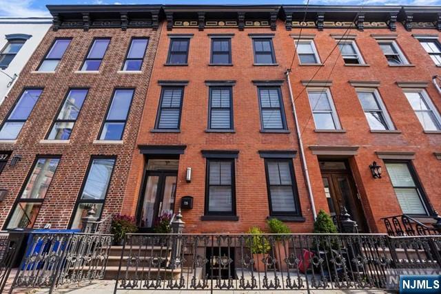 Welcome to 735 Bloomfield Street, a rarely available 20ft wide Brownstone on one of Hoboken's most sought after streets. The moment you enter you will appreciate every attention to detail that was taken in this impeccably designed 4 story home. The open kitchen with a spacious quartz center island & breakfast bar is perfect for entertaining. The living room offers a wall of glass & sliding doors onto a lush patio, raised terrace & garden. The open layout of the ground fl offers various options as a family room, gym or guest suite and looks out to a lower level walkout brick patio through another wall of glass and sliding doors. The upper two floors of the home feature 4 spacious bedrooms including a primary bedroom suite that is truly unique. Featuring soaring ceilings, en-suite bath, custom walk-in closet & sitting area making this a private sanctuary unlike any you will find in Hoboken. A private tree-lined terrace off the top floor east facing BR is the perfect escape to unwind after a long day. Additional features include Chestnut wood flooring, two zone HVAC system, laundry room, venetian plaster, beautiful wood molding & Skylights which add terrific light throughout the home. This is truly the perfect combination of location, spacious living & luxury renovations. Ideally situated near shops, dining, parks, the Hoboken Waterfront Walkway, and convenient NYC transportation, including the NY Waterway ferry, PATH, and bus to Port Authority. The very best of Hoboken living.