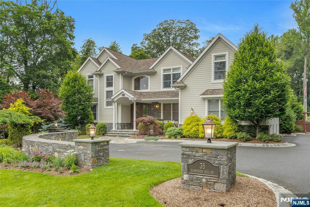 LOOK NO FURTHER FOR AN ELEGANT RESIDENCE WITH A BACKYARD RETREAT YOU CAN ENJOY WITH FAMILY AND FRIENDS! A WELCOMING COVERED BLUESTONE PORCH AND IMPRESSIVE TWO-STORY OPEN FOYER INVITE YOU IN TO THIS YOUNG 5 BEDROOM COLONIAL. AT THE HEART OF THE HOME IS A SPACIOUS CHEF'S KITCHEN, FEATURING TOP APPLIANCES, A GENEROUS CENTER ISLAND WITH SEATING, A BRIGHT BREAKFAST AREA, AND A CONVENIENT BUTLER'S PANTRY CONNECTING TO THE FORMAL DINING ROOM. STEP OUTSIDE TO DISCOVER A SHOW-STOPPING BACKYARD DESIGN WITH A SPRAWLING OUTDOOR KITCHEN FOR AL FRESCO FEASTS, AND SALTWATER POOL AND SPA. A PRIVATE POOLSIDE CABANA SERVES AS A SECLUDED ESCAPE, BOASTING A LIVING ROOM/KITCHEN COMBO, FULL BATH AND LAUNDRY, IDEAL FOR GUESTS OR LOUNGING. INSIDE THE HOME, YOU WILL APPRECIATE THE OPEN FLOOR PLAN AND FAMILY ROOM WITH COFFERED CEILING AND FIREPLACE. THE PRIMARY SUITE OFFERS A SERENE SPACE COMPLETE WITH FIREPLACE, SOARING CEILINGS, GENEROUS CLOSET SPACE AND A SPA-LIKE BATH. ADDITIONAL BEDROOMS FEATURE VOLUME CEILINGS AND BATHROOMS IN NEUTRAL TONES. OTHER SPECIAL FEATURES INCLUDE A 3 CAR HEATED GARAGE, BASEMENT WITH POURED CONCRETE WALLS AND HIGH CEILINGS, SECURITY SYSTEM AND WHOLE HOUSE GENERATOR. THIS OVERSIZED LOT IS LEVEL AND OVER 300 FT DEEP! WHETHER HOSTING CELEBRATIONS OR ENJOYING QUIET FAMILY TIME, THIS HOME IS A HARMONIOUS BLEND OF STYLE AND EVERYDAY EASE.