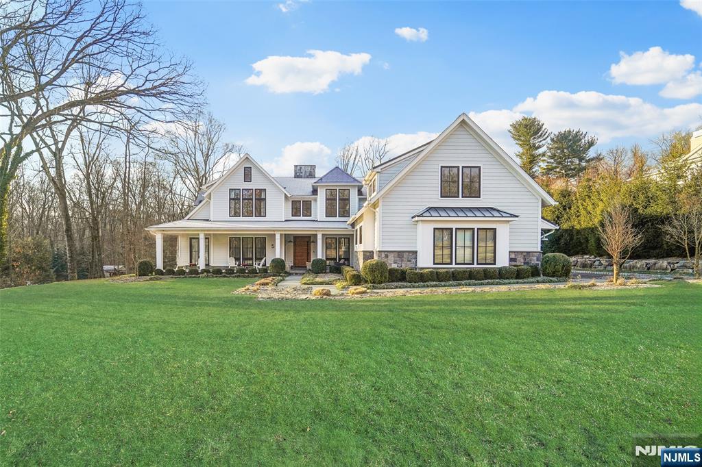 Experience the pinnacle of modern luxury on one of Upper Saddle Riverâ€™s most desirable streets. Constructed in 2017 by Park Hill Development, this masterfully designed residence looks straight out of the pages of Architectural Digest. A grand foyer welcomes you into a bright, open interior with hardwood floors and high-end designer features. At the heart of the home is a 2-story great room with floor-to-ceiling windows & fireplace seamlessly connected to a sleek eat-in kitchen. The 1st level features a formal dining room, living room, office, 2 wet bars, and a fully equipped bedroom suite with the option for its own entry. Four ensuite bedrooms upstairs (with potential for a 5th), including the Primary suite with a spa-like bath, mega walk-in closet, laundry, and 2nd family room space. Manicured fenced yard with room for a pool (plans available upon request), patio and a covered area with a built-in fireplace. A partially finished basement and 3-car attached garage add to the appeal.