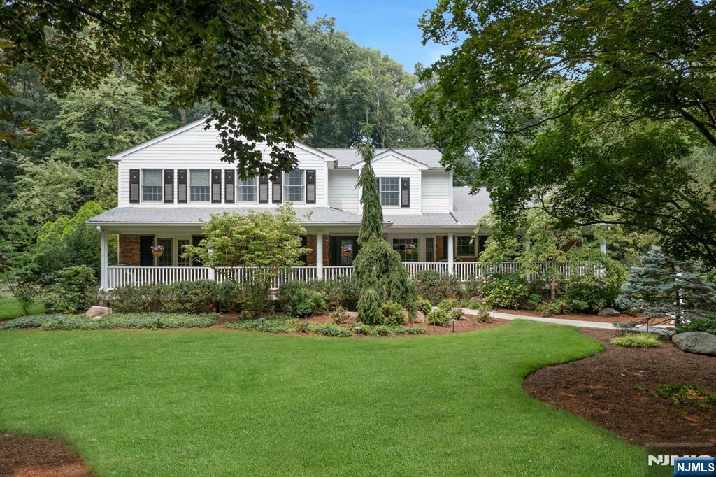 Modern elegance, exceptional craftsmanship, and timeless Colonial design define this stunning 7-bedroom, 4 full bath, and 3 half bath residence in a quiet cul-de-sac in Wyckoff's highly sought-after Hartung section. The welcoming Entry Foyer opens to an expansive floor plan with beautiful hardwood floors & sophisticated living spaces designed for everyday comfort and effortless entertaining. The custom gourmet Kitchen is the heart of the home, featuring top-of-the-line appliances, abundant cabinetry, ample counter space, a seated island, & a breakfast area. It flows seamlessly into the gorgeous Dining Rm W/Fpl, lovely Sun Rm, & spacious Family Room w/Fpl. The 1st floor also offers exceptional flexibility with 2 bedrooms sharing a full bath(home office option), a private ensuite bedroom ideal for guests or extended family, and a powder room. Upstairs, the Lux Primary Suite features a vaulted ceiling, WIC, laundry, and a spa-like bath. 3 additional generously sized bedrooms, a full bath, and walk-in attic storage complete the second level. The finished lower level offers large recreation areas, a half bath, laundry, mud room, and abundant storage. Outside, enjoy a private resort-style oasis with a fenced backyard, covered outdoor kitchen, outdoor fireplace, spectacular heated,saltwater pool with spa, pool house, and beautifully landscaped grounds. 2 car garage. Generator.Top schools. This is an exceptional home in a highly desirable neighborhood!! You will love living here!