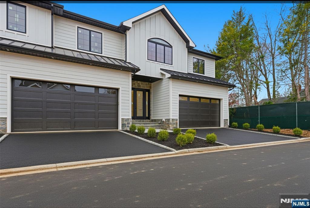 *Enter â€œ95 County Rdâ€ into your navigation app, as the new address does not currently appear* Welcome to an exclusive new 8-unit townhouse community, where luxury meets nature in perfect harmony. Nestled in a serene setting with top-rated schools, convenient access to NYC, and a wealth of dining and shopping options minutes away, this custom-built townhome is the epitome of refined living. Set for completion in February 2026, each residence offers impeccable finishes throughout including over 4000 square feet of living area! Upon entry, you're greeted by a designer kitchen, a sophisticated living and dining area, and a family room that opens to a picturesque patio. Upstairs, you'll find two bedrooms with a shared hall bath, a junior suite with a private bath, and the expansive primary suite, featuring a spa-like en suite bathroom and walk-in closet. The fully finished basement is designed for comfort, boasting a home office, rec room, family room, and an additional full bathroom. Experience the blend of community charm and modern luxury at Cedar Lux Development Complex! Property taxes estimated to be between $25,000-$27,500