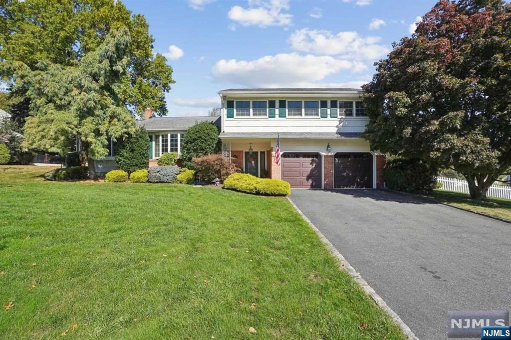 Location, Location...Neighborhood you have been waiting for, Tree lined, Quiet dead end Drive...4 Bdrm, 2.1 bth offers Comfortable Living with HW Flrs thruout, Bright LR w/Bay wdw leads to Stylish Kit w/Ctr Island, Viking Stove, Granite counters, Slider to 12X12 Conservatory w/door to Deck, Extended 23X15 DR w/10'ceiling & uplighting, Few steps away leads to Den w/gas Fpl & Slider door to private Patio w/Pergola & Fenced Yard. Finished Bsmt w/wall to wall storage closets, Spacious Bedrms, Attic storage, 2 Car Garage. Top Rated Schools. Beautiful Verona Park. Convenient to all Transportation, Shopping & Restaurants...